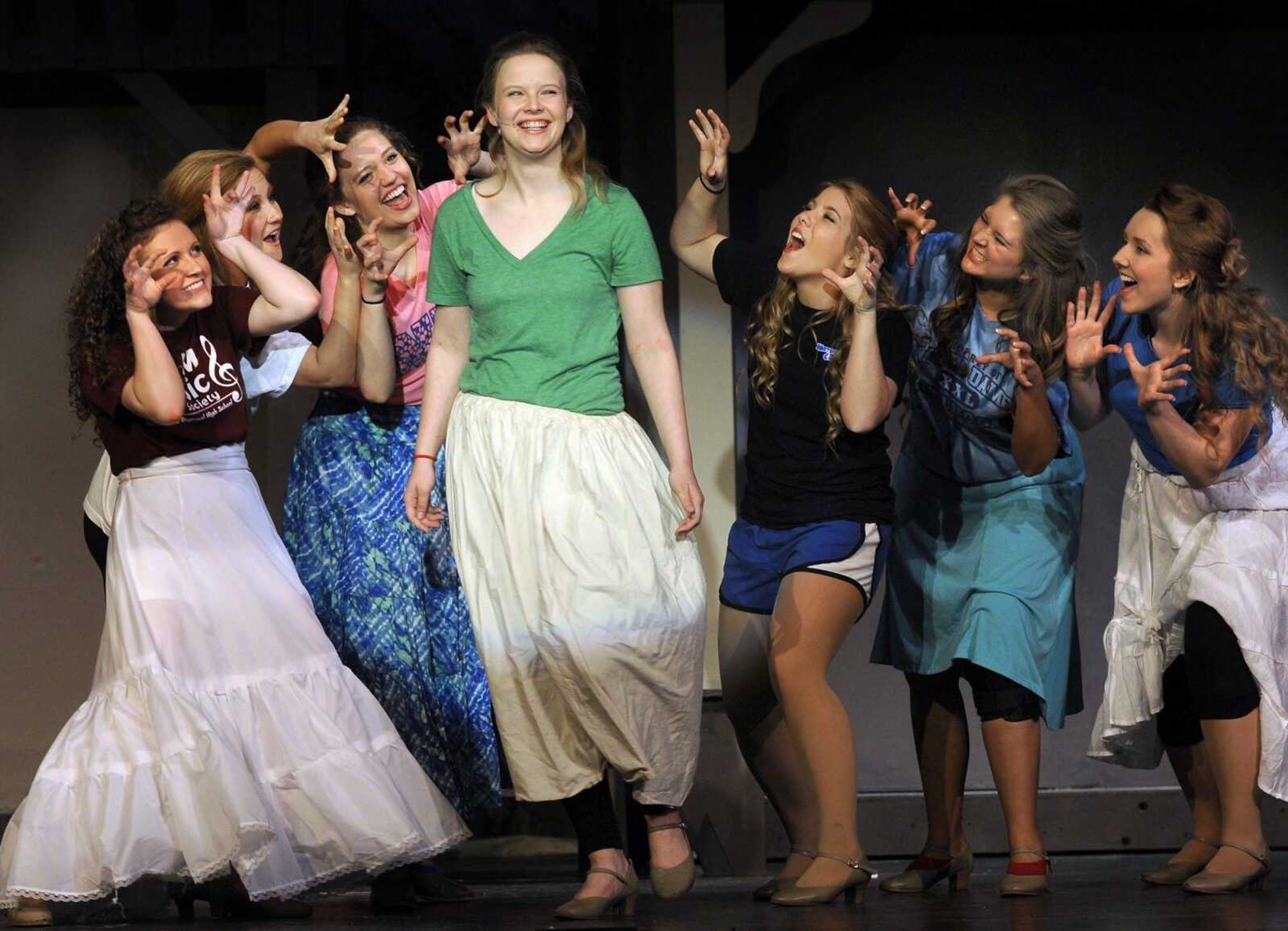 In a scene from Notre Dame Regional High School&#8217;s production of &#8220;Seven Brides for Seven Brothers,&#8221; six townsgirls tell Milly it will be dangerous to marry Adam. From left are Lindsey Grojean as Alice, Sarah Stroup as Martha, Chole Kasten as Liza, Amber Vandeven as Milly, Regan Kapp as Sarah, Chelsea Carroll as Ruth and Abby Minor as Dorcas. (Fred Lynch)