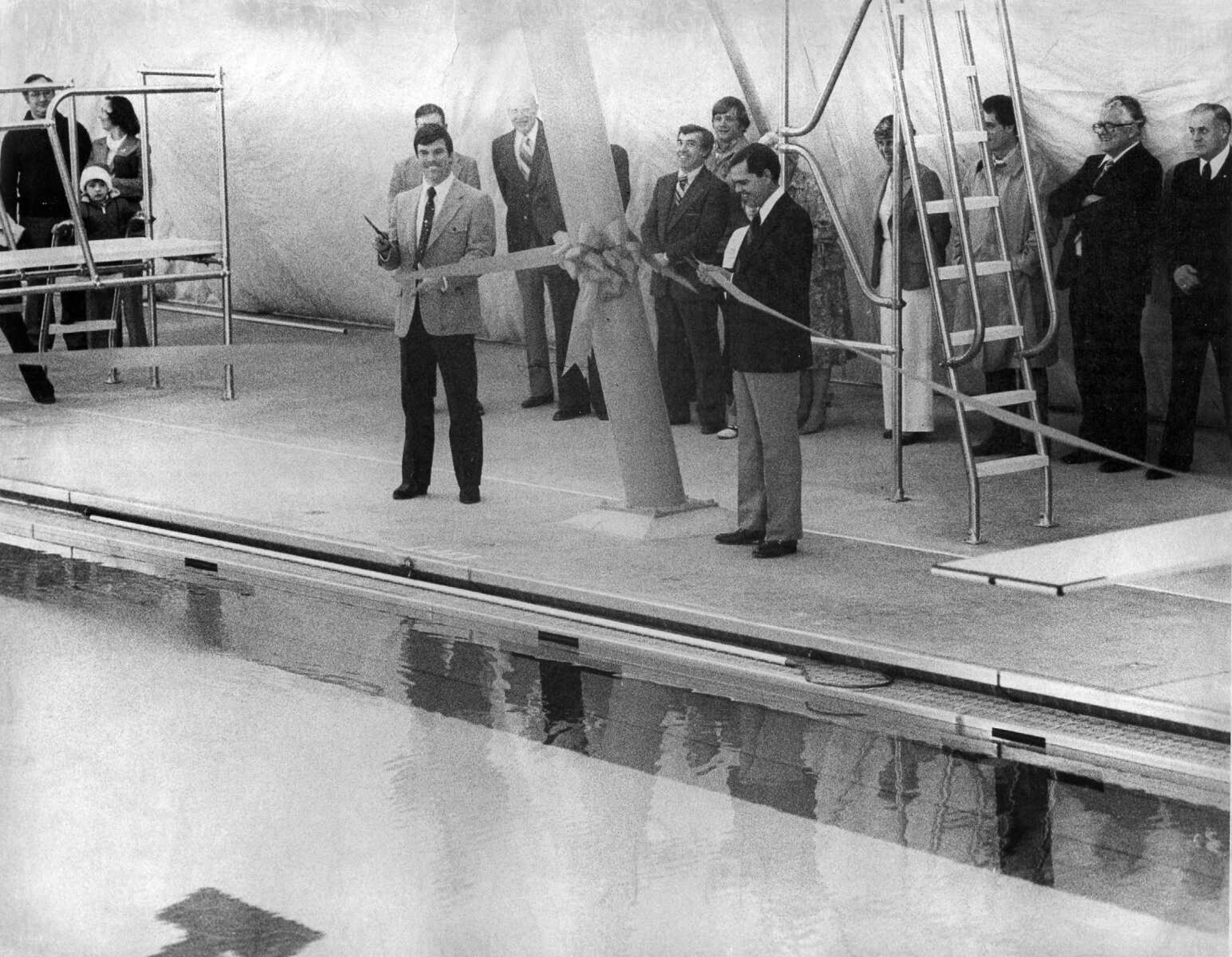 Published March 9, 1980.
Kent Cargle, left, president of the Cape Girardeau Board of Education, and Mayor Paul W. Stehr shared in a ribbon-cutting ceremony at the new $1.1 million city-school swimming pool. The 50-meter indoor pool, on the campus of Central High School, opened to the public March 9, 1980. (Southeast Missourian archive)