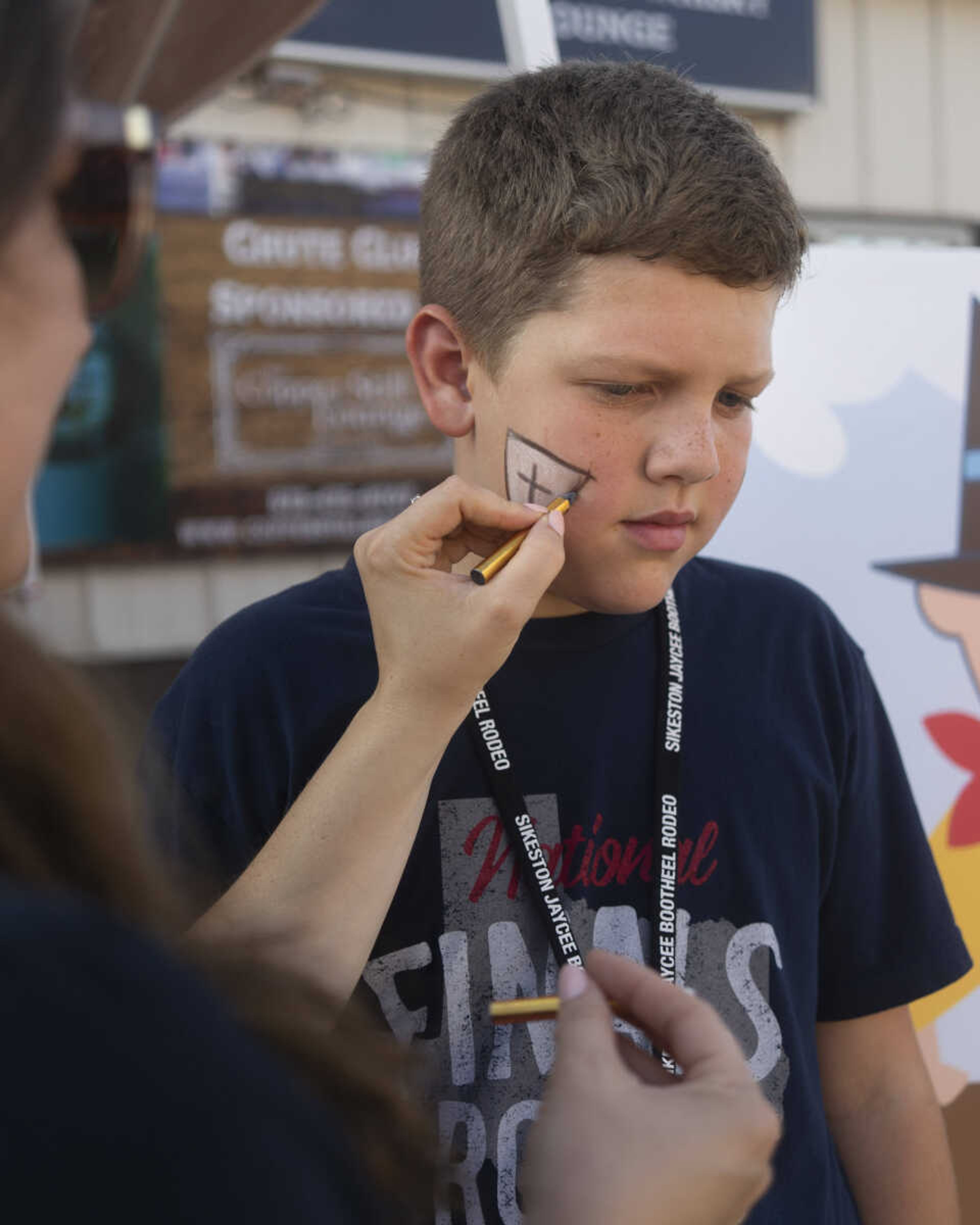 Carter Hay, 10, has his face painted as a bullfighter before the second night of the Sikeston Jaycee Bootheel Rodeo on Thursday, Aug. 12, 2021, in Sikeston, Missouri.