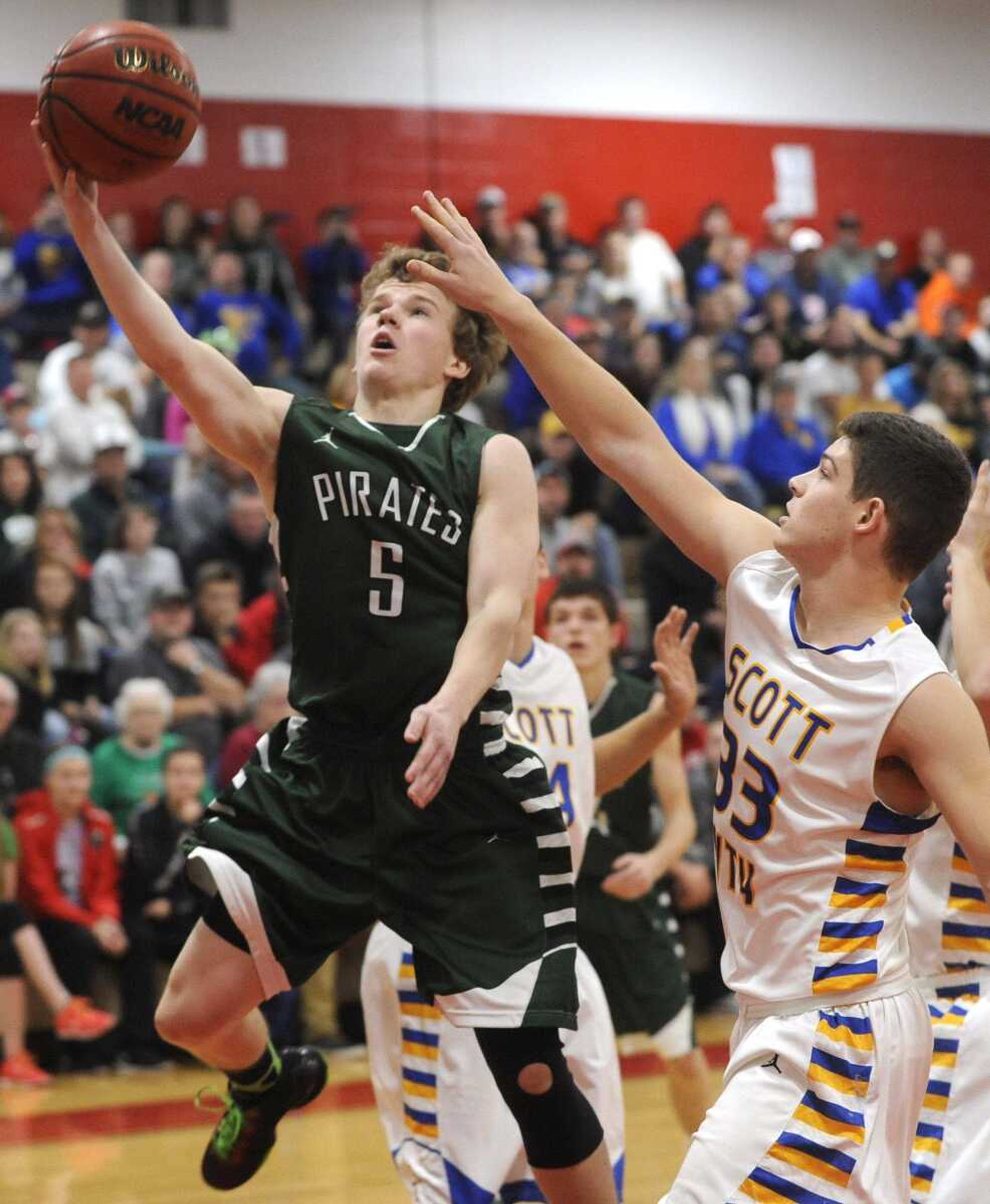 Perryville's McGwire Bartley takes a shot as Scott City's Braden Cox defends during the first quarter of the championship game in the Woodland Invitational on Friday, Dec. 4, 2015 in Marble Hill, Missouri. (Fred Lynch)