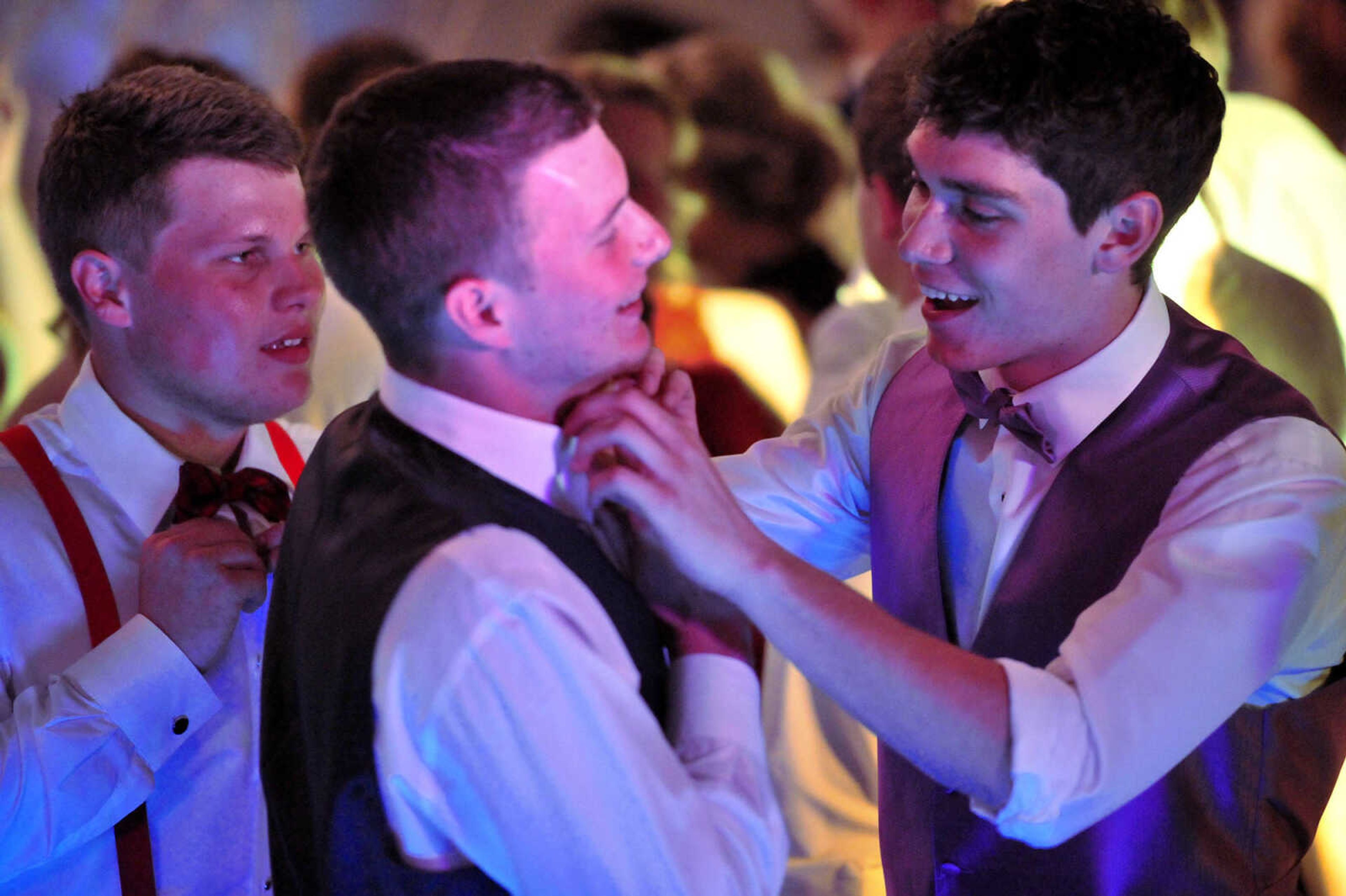 Oran students adjust their wardrobe during their prom Saturday, April 8 at Oran High School.