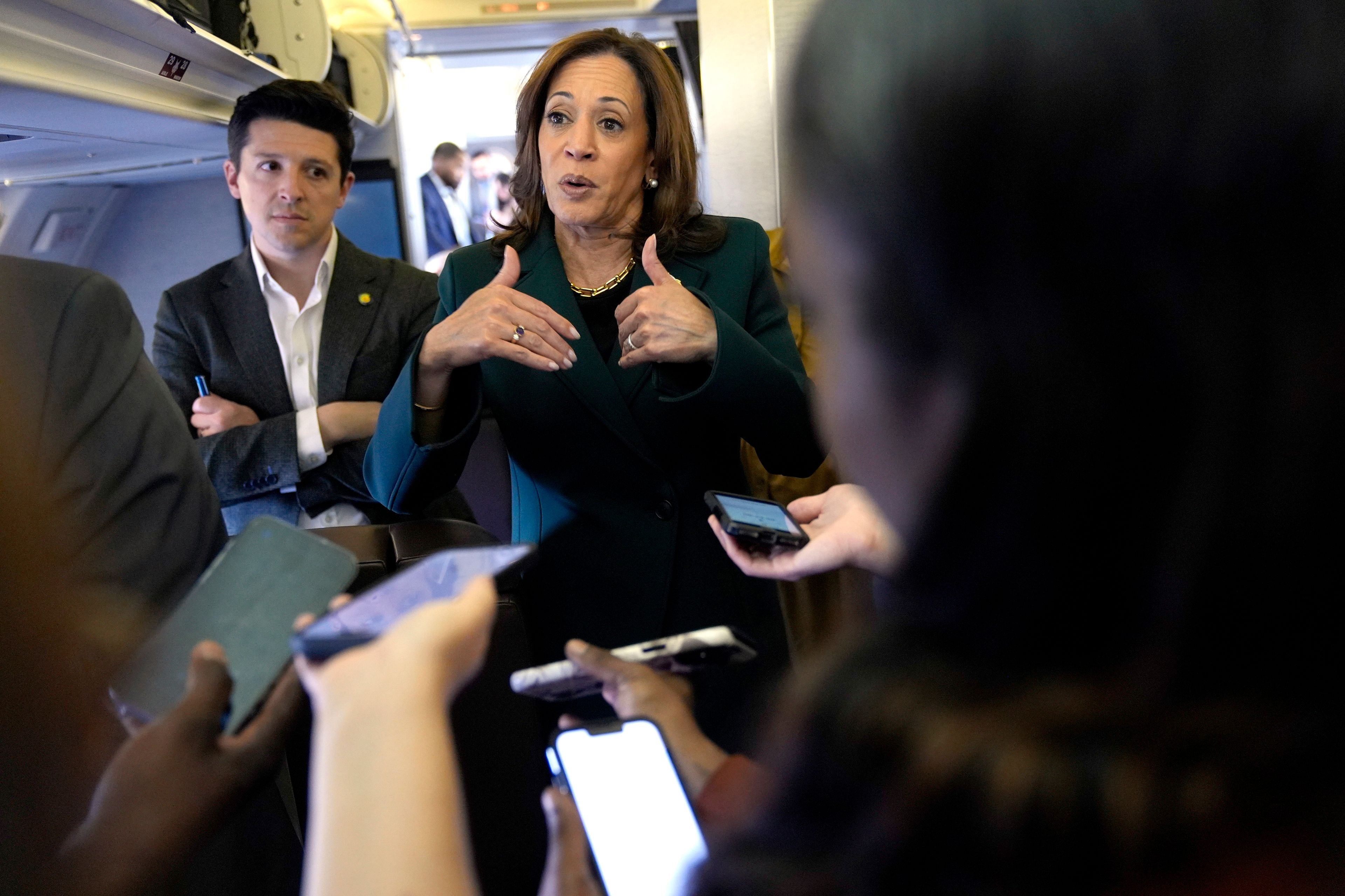 Democratic presidential nominee Vice President Kamala Harris speaks with members of the press on board Air Force Two at Philadelphia International Airport, Monday, Oct. 21, 2024, in Philadelphia, before departing to Michigan. (AP Photo/Jacquelyn Martin, Pool)