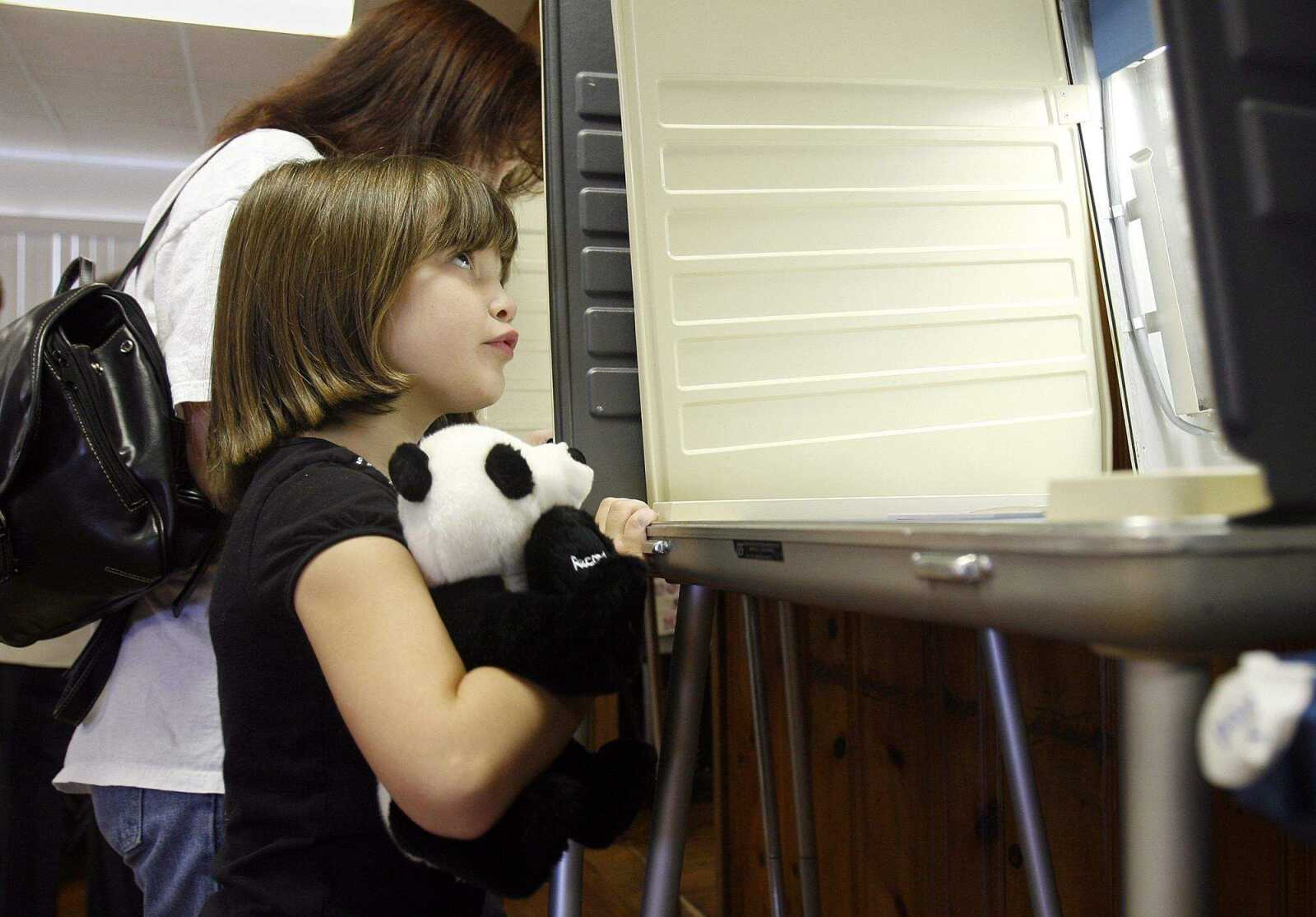 ELIZABETH DODD ~ edodd@semissourian.com
Taylor Wilson, 6, of Jackson, waits for her mom, Susan, to finish voting with her stuffed animal named "Panda" at the American Legion in Jackson on Tuesday.