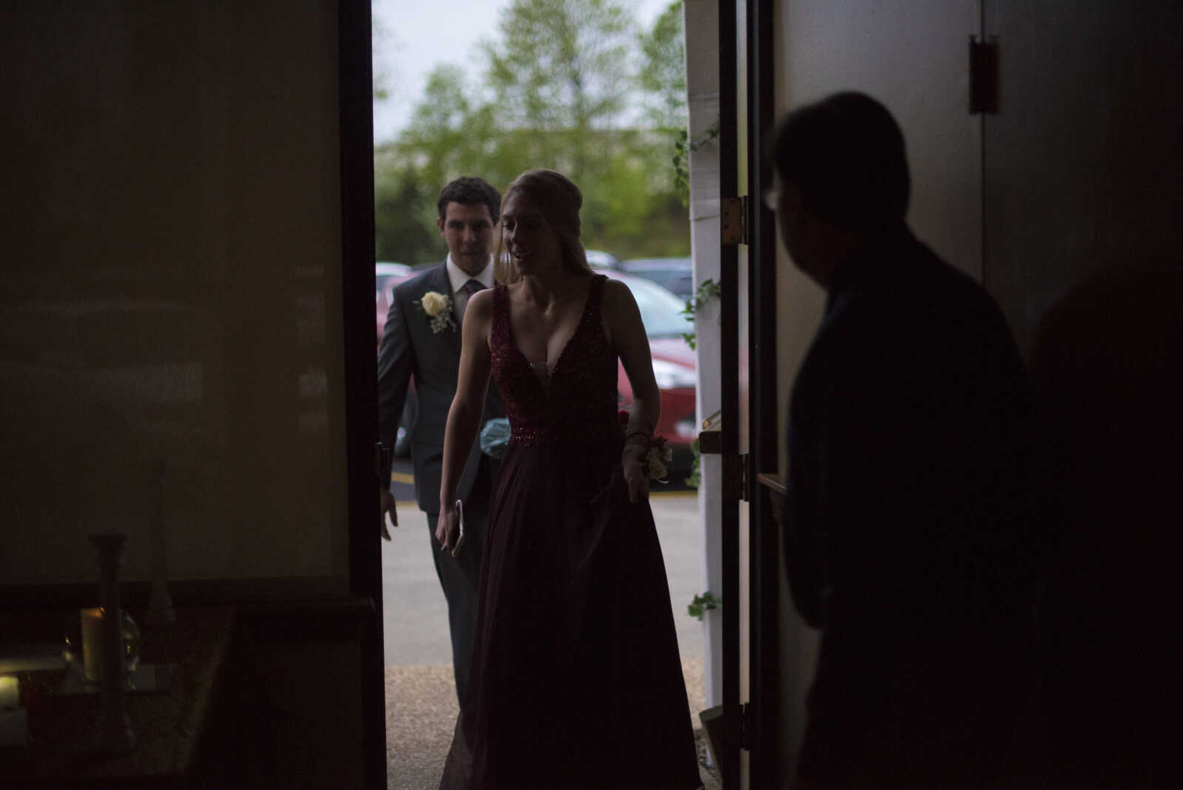 Gavin Brown and Laura Mueller enter prom during the Saxony Lutheran prom Saturday, April 22, 2017 at the Elk's Lodge in Cape Girardeau.