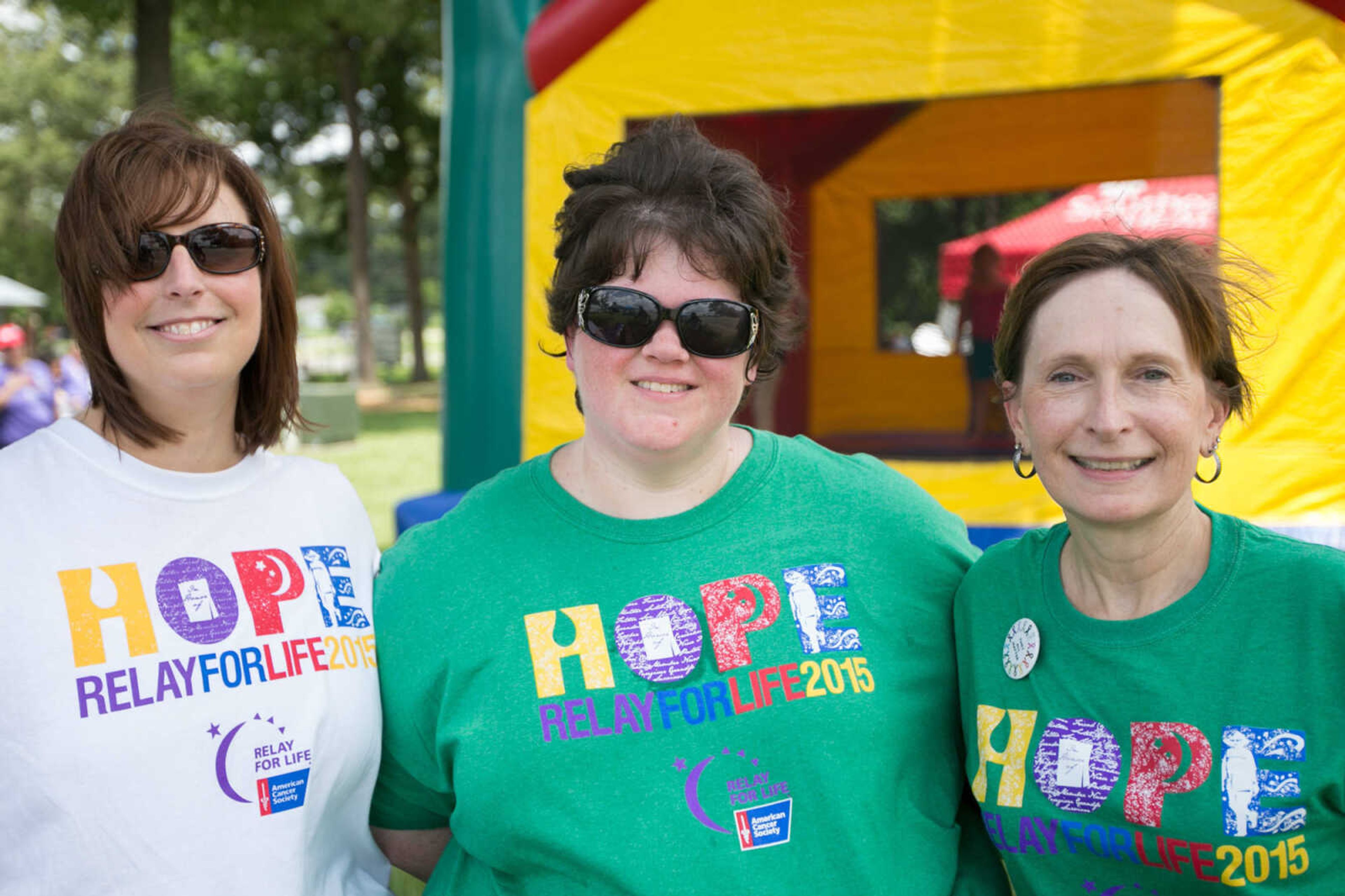 GLENN LANDBERG ~ glandberg@semissourian.com

Jennifer Ward, left, Alisha Grant and Mitzi Richter pose for a photo during the Relay for Life of Cape Girardeau County fundraiser at Arena Park, Saturday, June 13, 2015.