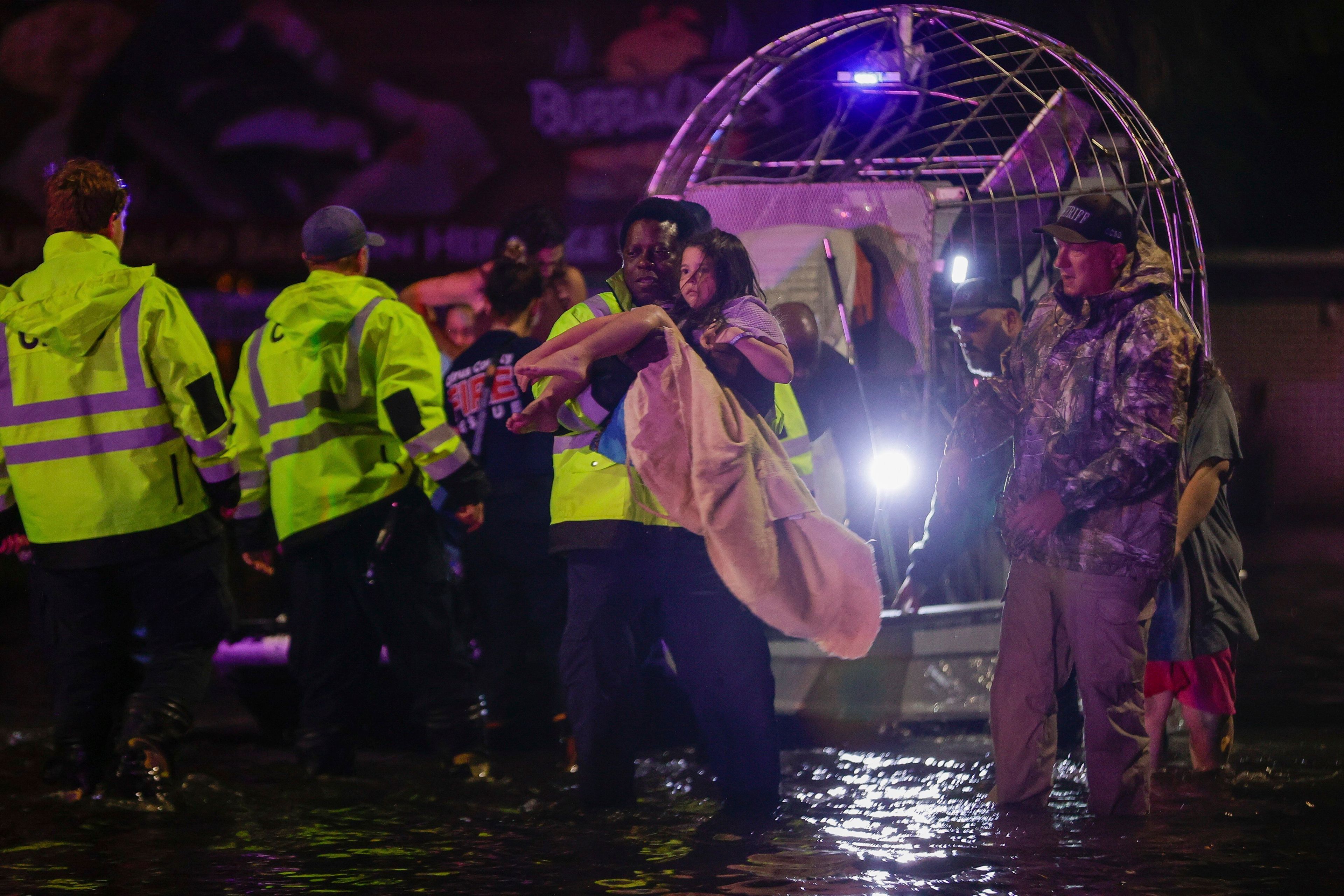 An airboat transports residents rescued from floodwaters in the aftermath of Hurricane Helene on Friday, Sept. 27, 2024 in Crystal River, Fla. (Luis Santana/Tampa Bay Times via AP)