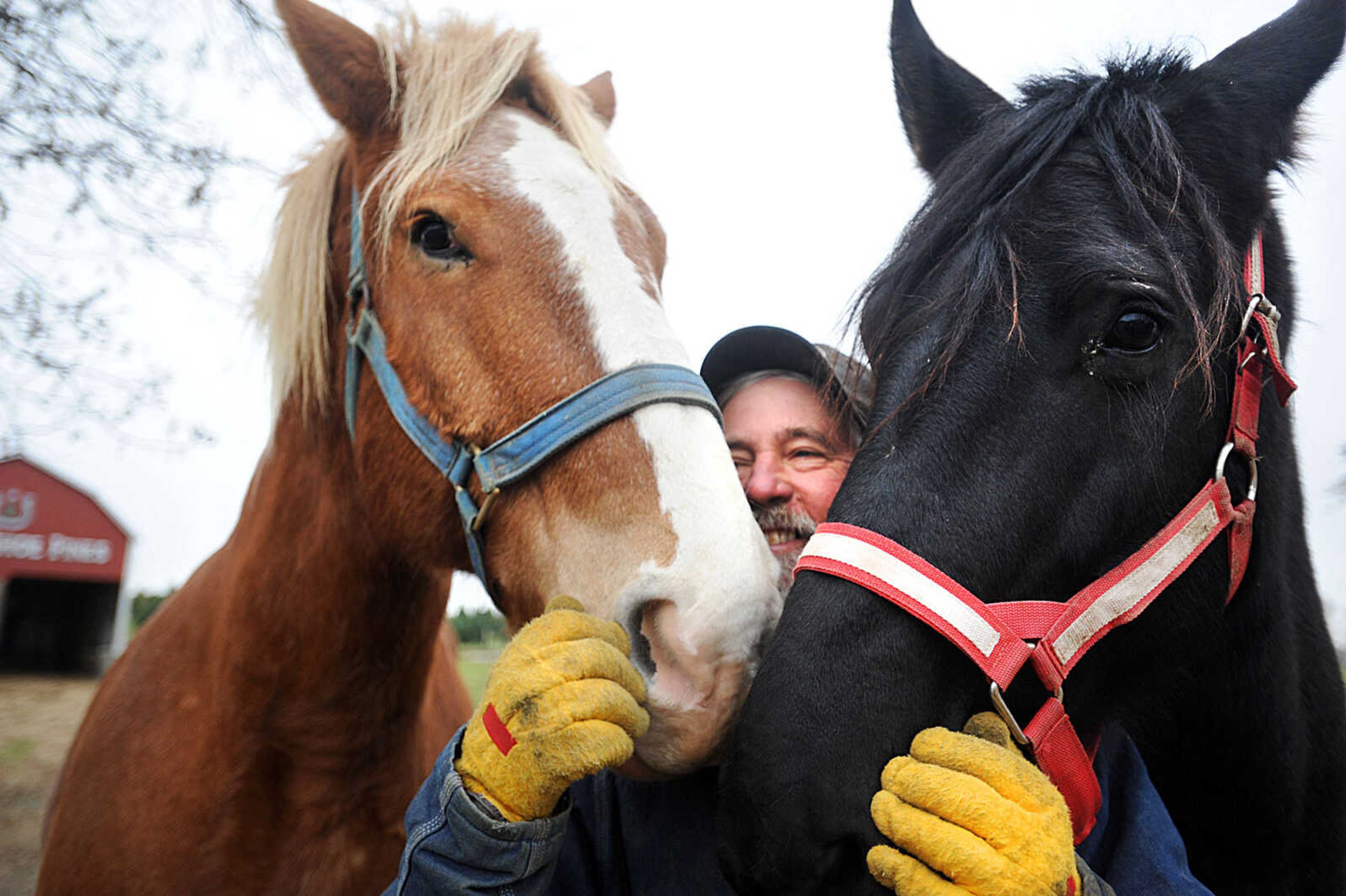 LAURA SIMON ~ lsimon@semissourian.com

Steve Meier gets some love from his horses, Vince, left, and Betty, Wednesday, Nov. 26, 2014, at Meier Horse Shoe Pines in Jackson.