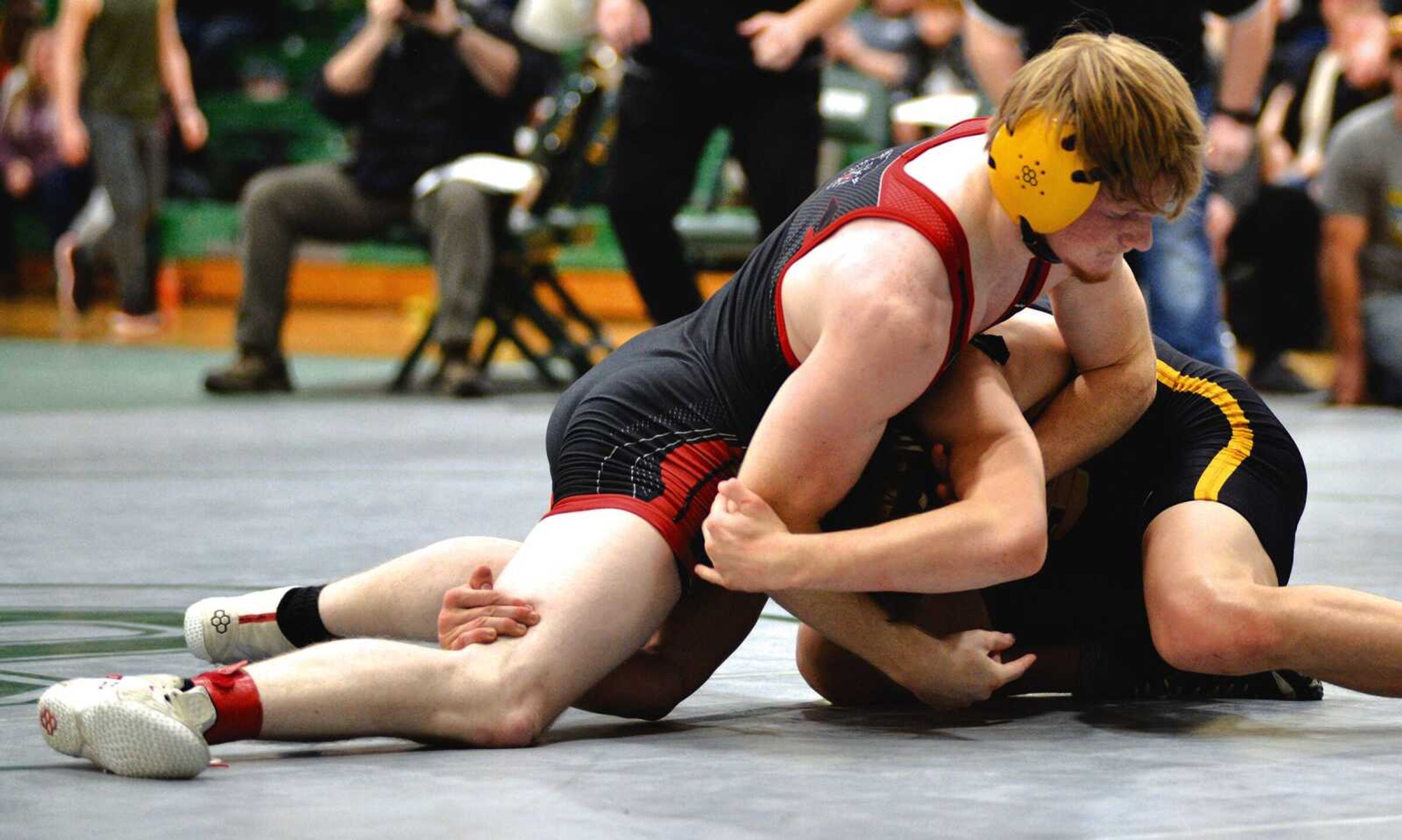 Eric Harmon wrestles in the championship match of the Class 2 District 1 Tournament on Saturday in Ste. Genevieve.