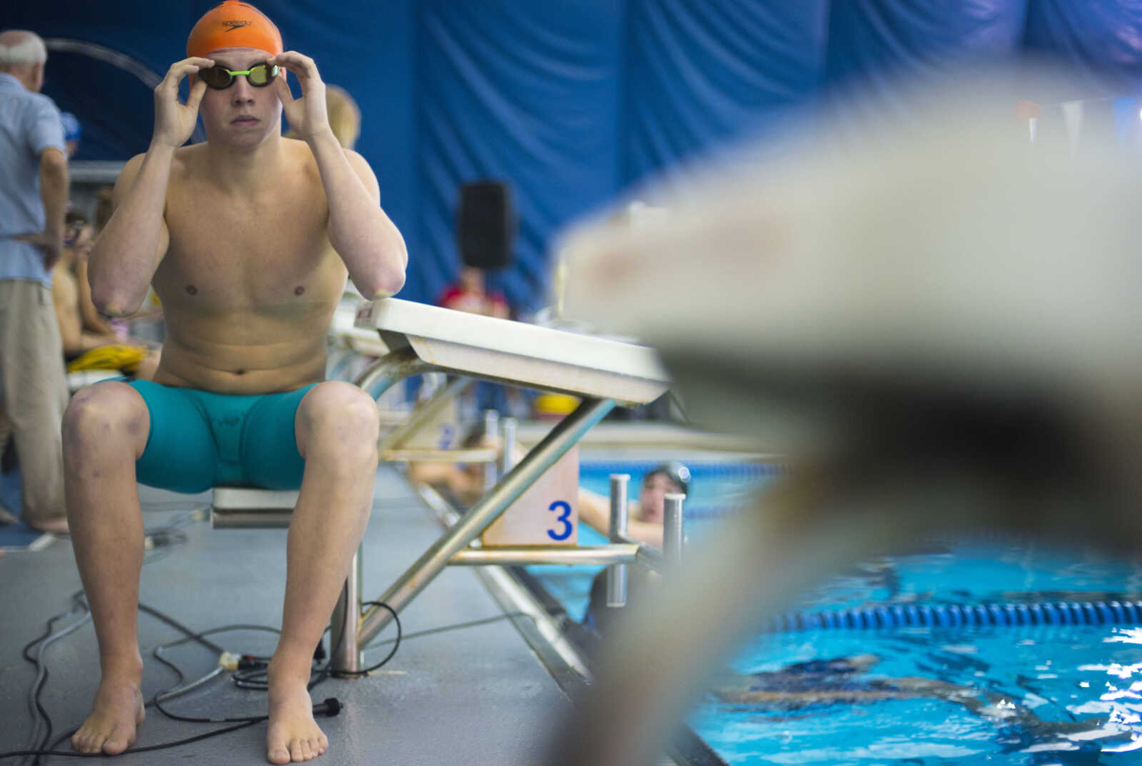 Cape Central swimmer Daniel Seabaugh adjusts his goggles before swimming a heat in the 500-yard freestyle race at the SEMO Conference championship swim meet Tuesday, Oct. 30, 2018, at the Central Municipal Pool in Cape Girardeau.