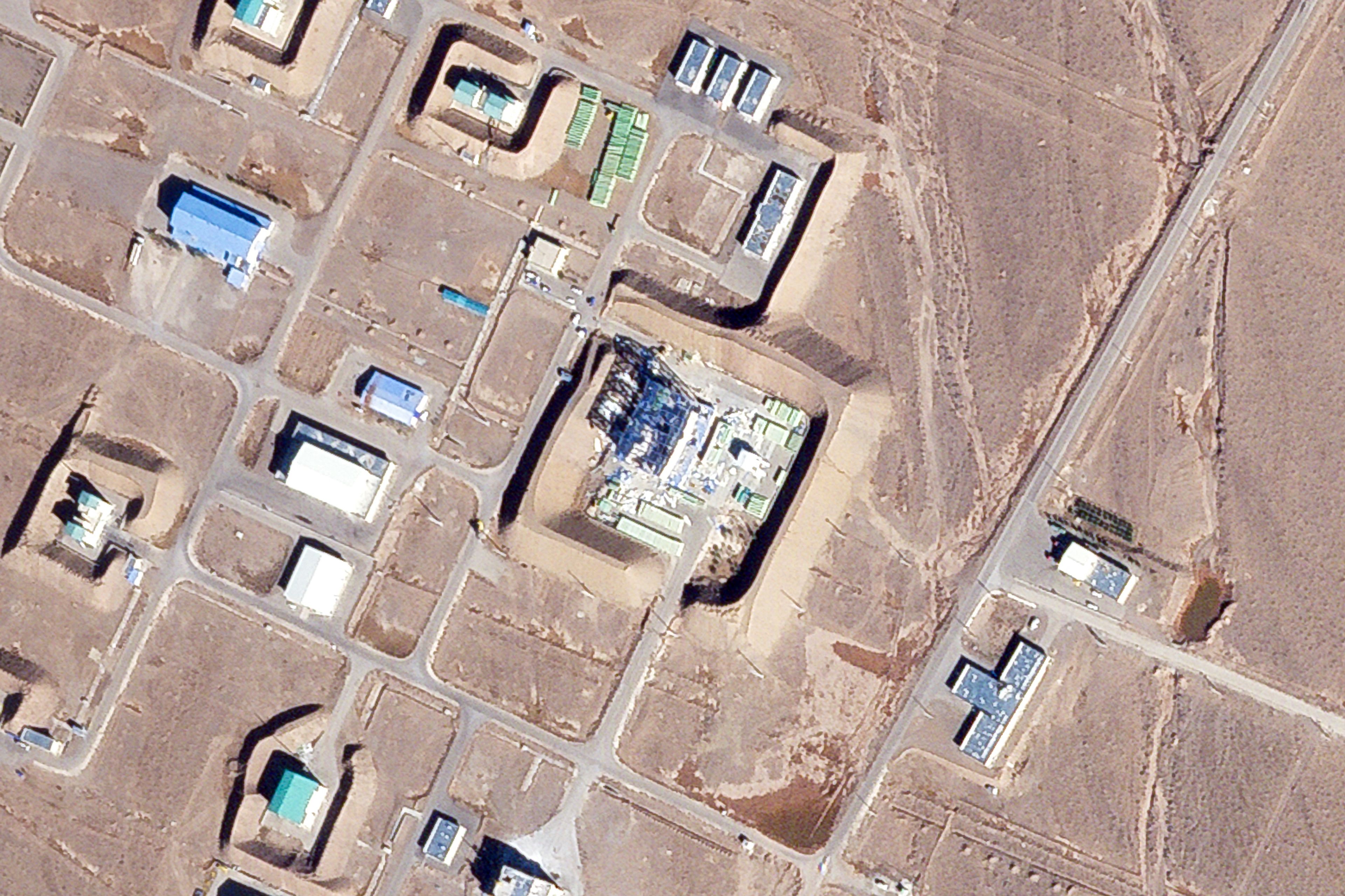 This satellite photo from Planet Labs PBC shows a damaged large building at the Revolutionary Guard's Shahroud Space Center in Semnan province, Iran, Tuesday Oct. 29, 2024. Israel's attack on Iran likely damaged a base run by the paramilitary Revolutionary Guard that builds ballistic missiles and launches rockets as part of its own space program, satellite images analyzed by The Associated Press on Tuesday showed. (Planet Labs PBC via AP)