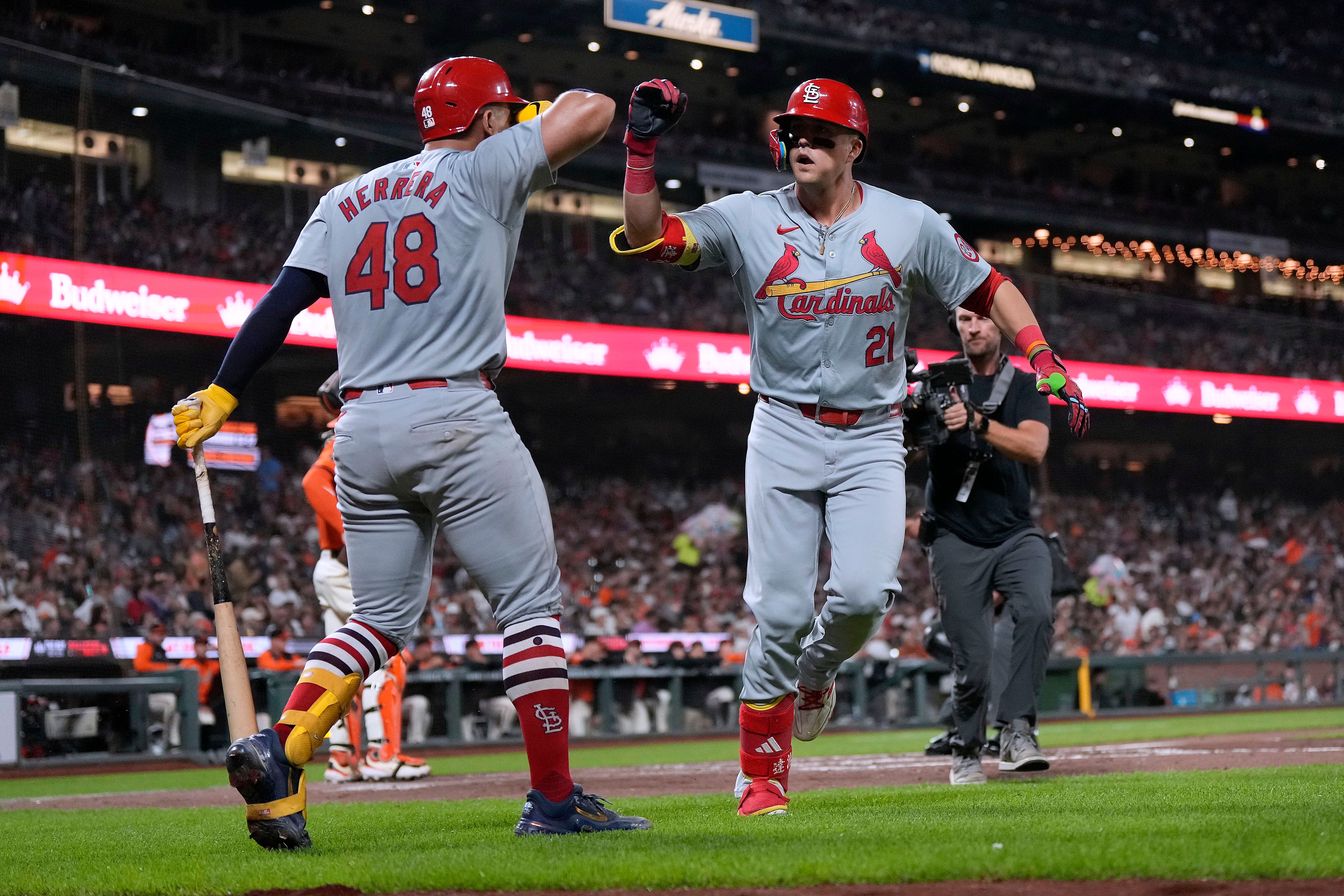 St. Louis Cardinals' Lars Nootbaar (21) is congratulated by Iván Herrera (48) after hitting a solo home run against the San Francisco Giants during the third inning of a baseball game Friday, Sept. 27, 2024, in San Francisco. (AP Photo/Tony Avelar)