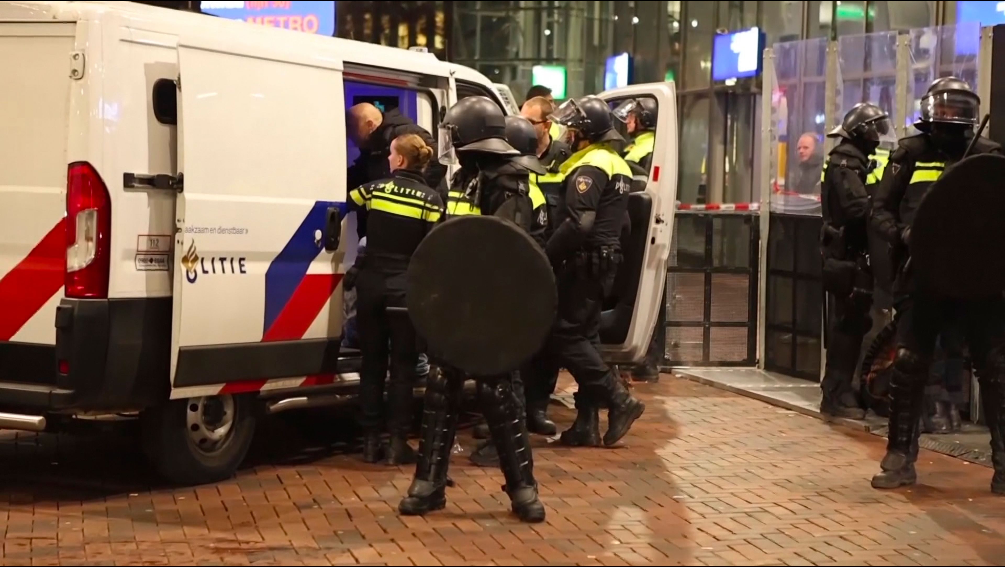 In this image taken from video, police detain a man near the Ajax stadium, after pro-Palestinian supporters marched despite a ban on pro-Palestinian demonstrations near the soccer stadium, in Amsterdam, the Netherlands, Thursday, Nov. 7, 2024. (AP Photo InterVision)