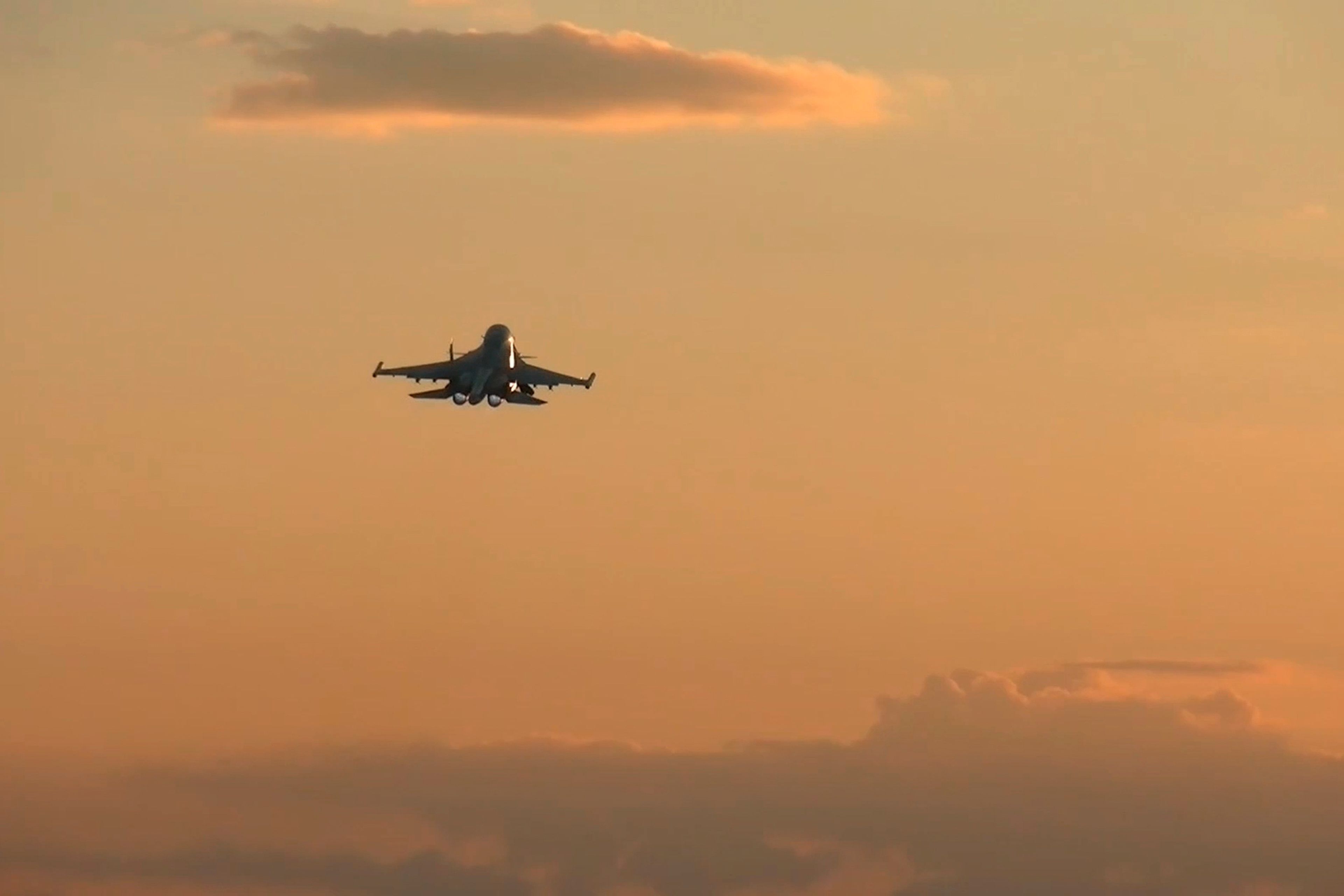 In this photo taken from a video released by Russian Defense Ministry press service on Tuesday, Nov. 5, 2024, a Su-34 bomber of the Russian air force operates at the border area of Kursk region, Russia. (Russian Defense Ministry Press Service via AP)