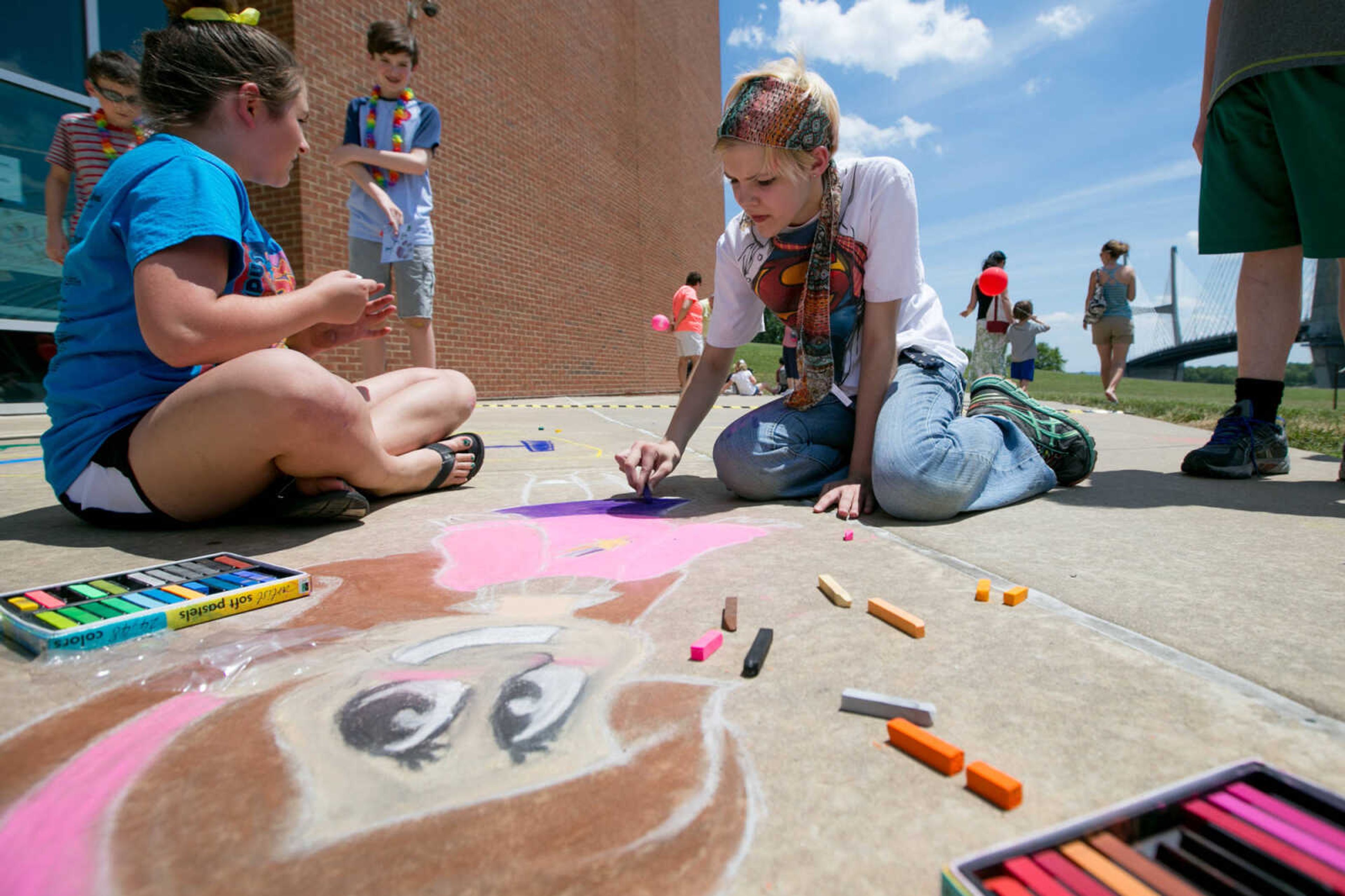 GLENN LANDBERG ~ glandberg@semissourian.com

Izzy Wissmiller, right, and Lily Pennington work on a chalk drawing Saturday, June 18, 2016 at the River Campus Summer Arts Festival.