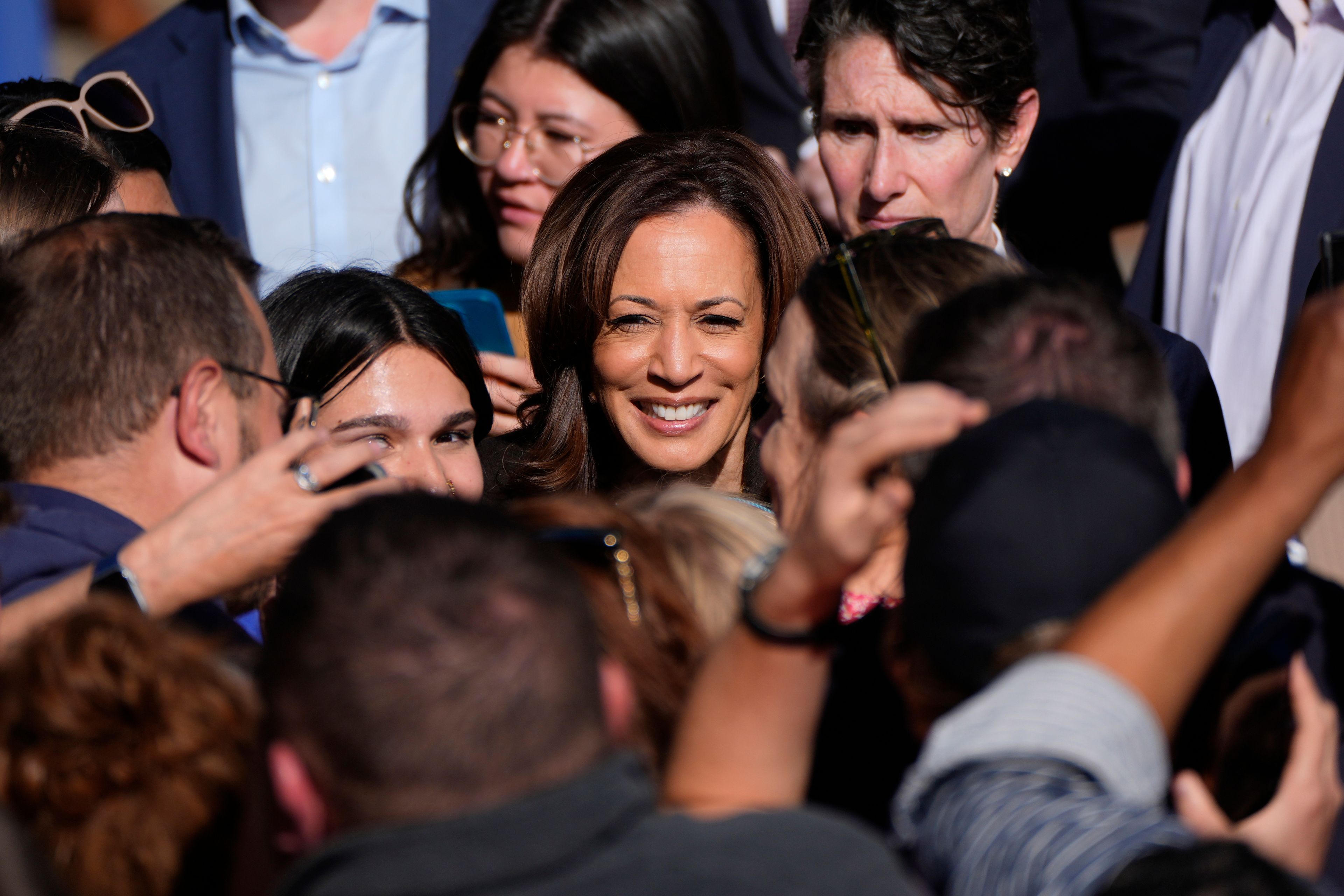 Democratic presidential nominee Vice President Kamala Harris greets supporters after speaking at a campaign rally in Riverside Park, Friday, Oct. 18, 2024, in Grand Rapids, Mich. (AP Photo/Paul Sancya)