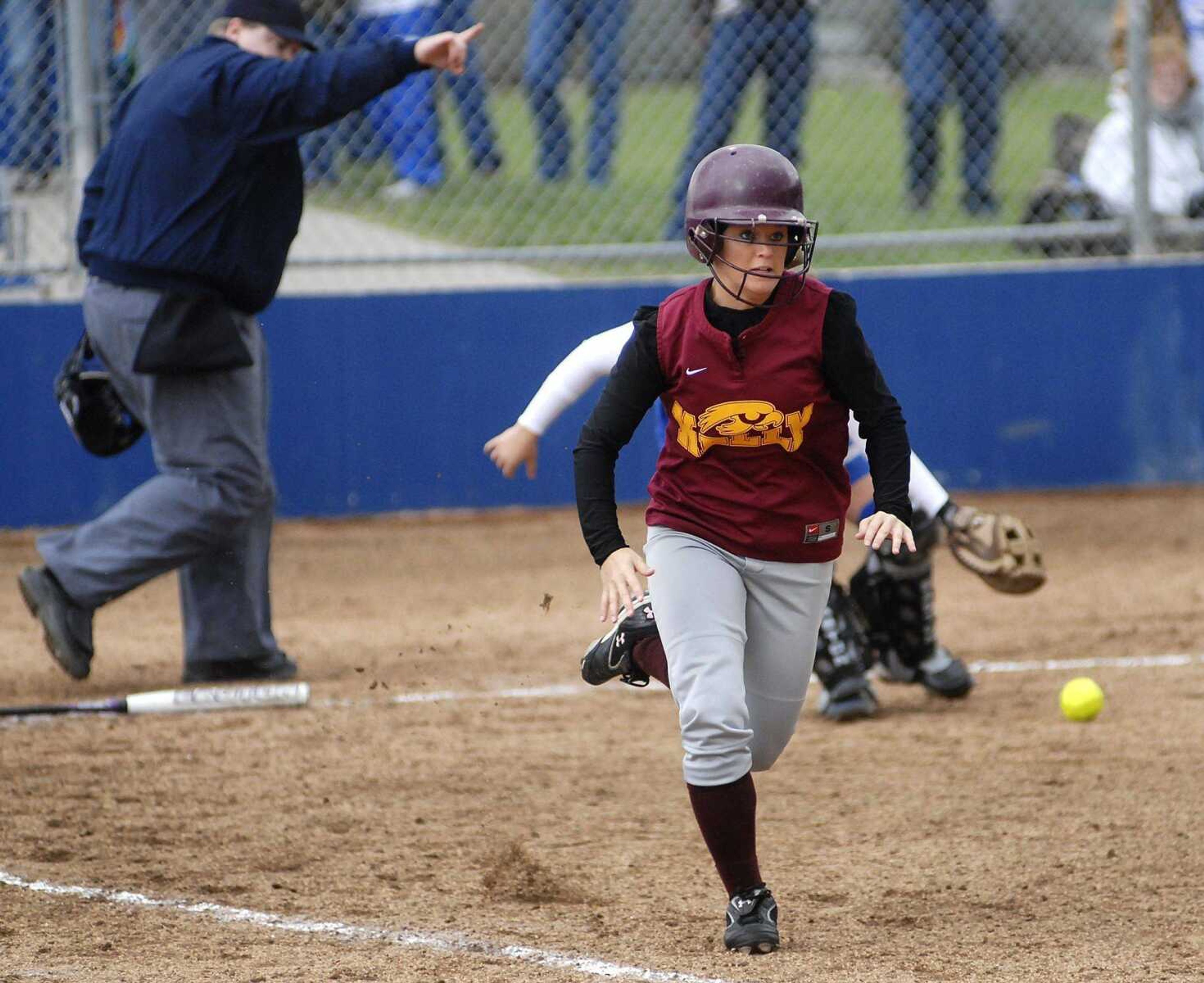 Heather Beggs runs to first base after bunting during Friday's semifinal victory.