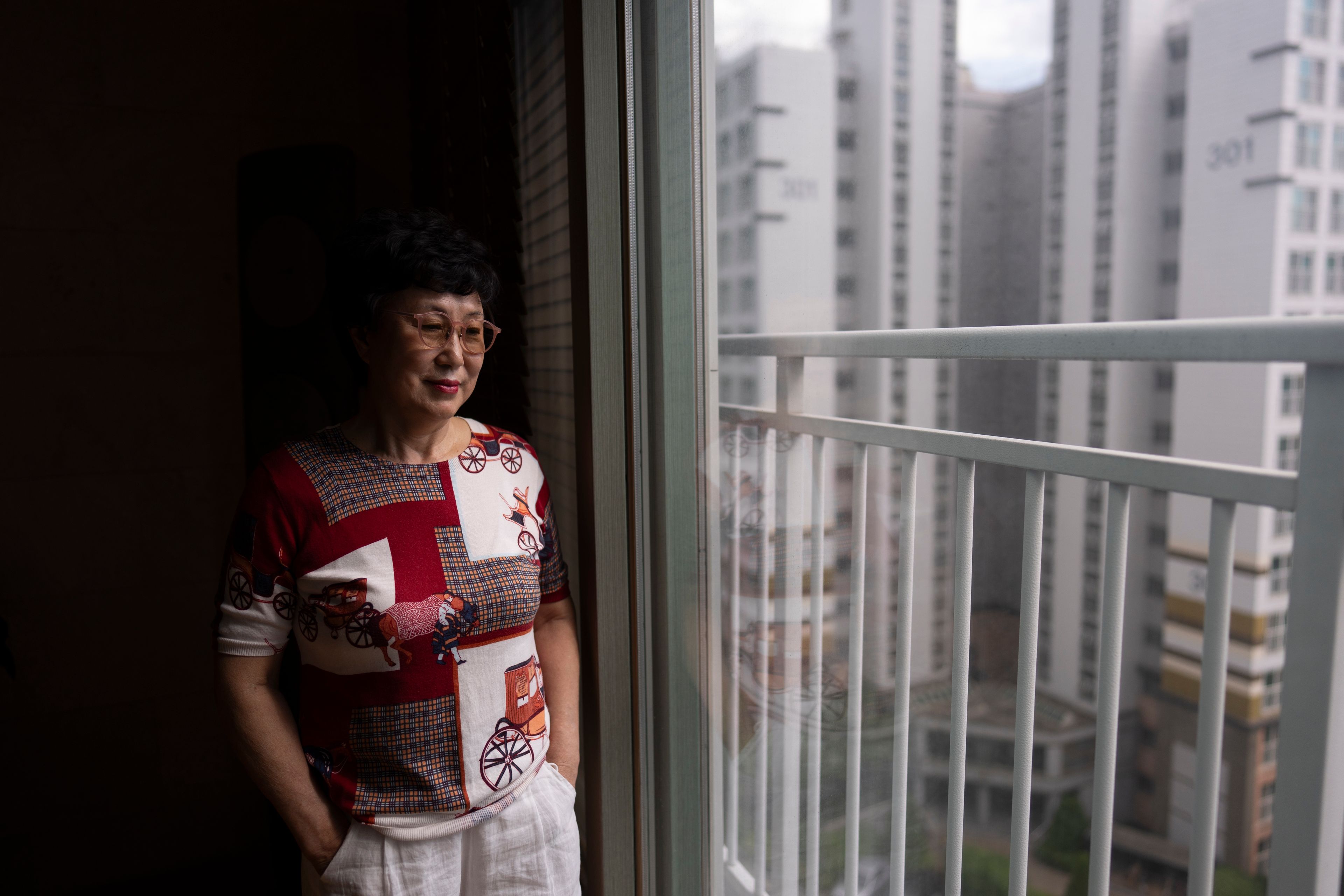 Han Tae-soon, who believed her daughter had been missing for years before discovering she had been adopted by a family in the United States, stands for a portrait at her home in Anyang, South Korea, Saturday, June 1, 2024. (AP Photo/Jae C. Hong)