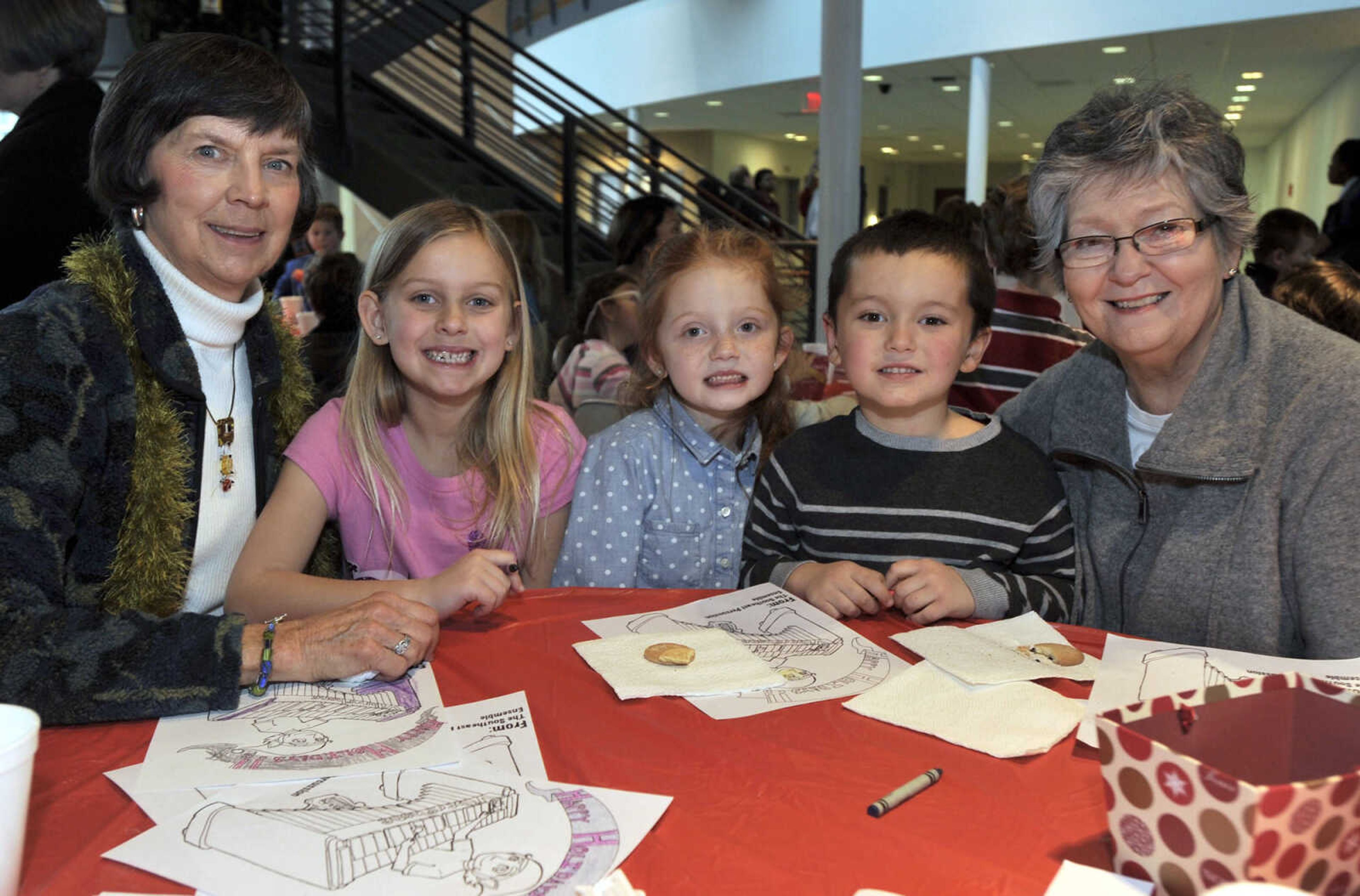 Joyce Miller, left, Sydney Miller, Berklee Miles, Wyatt Segraves and Charolyn Robison pose for a photo after a concert by the university percussion ensemble Saturday, Dec. 13, 2014 at the River Campus.