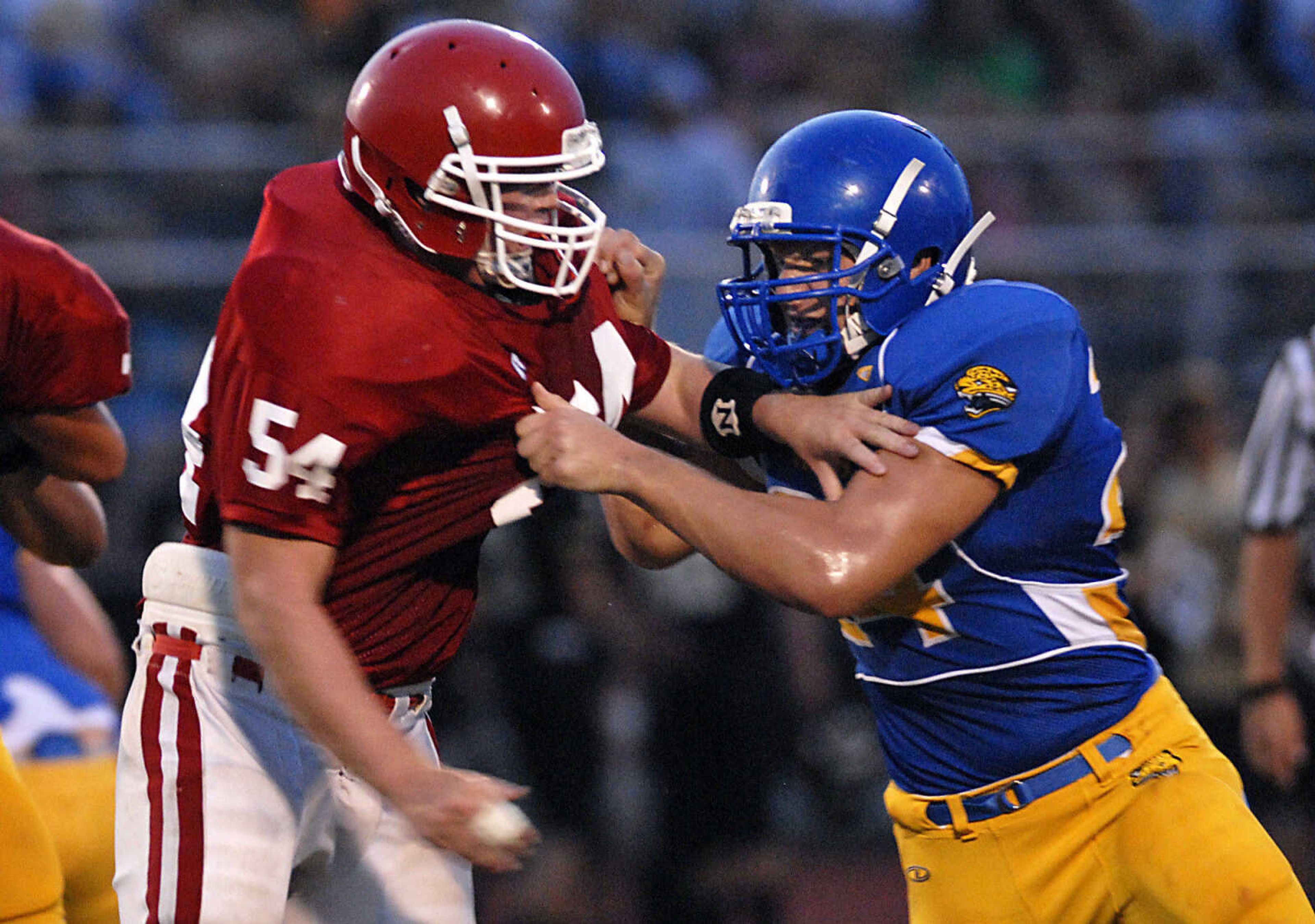 KRISTIN EBERTS ~ keberts@semissourian.com

Jackson's Jacob Jones struggles to get around Seckman's Kyle Eaves during a jamboree game on Friday, August 20, 2010, at Farmington High School.