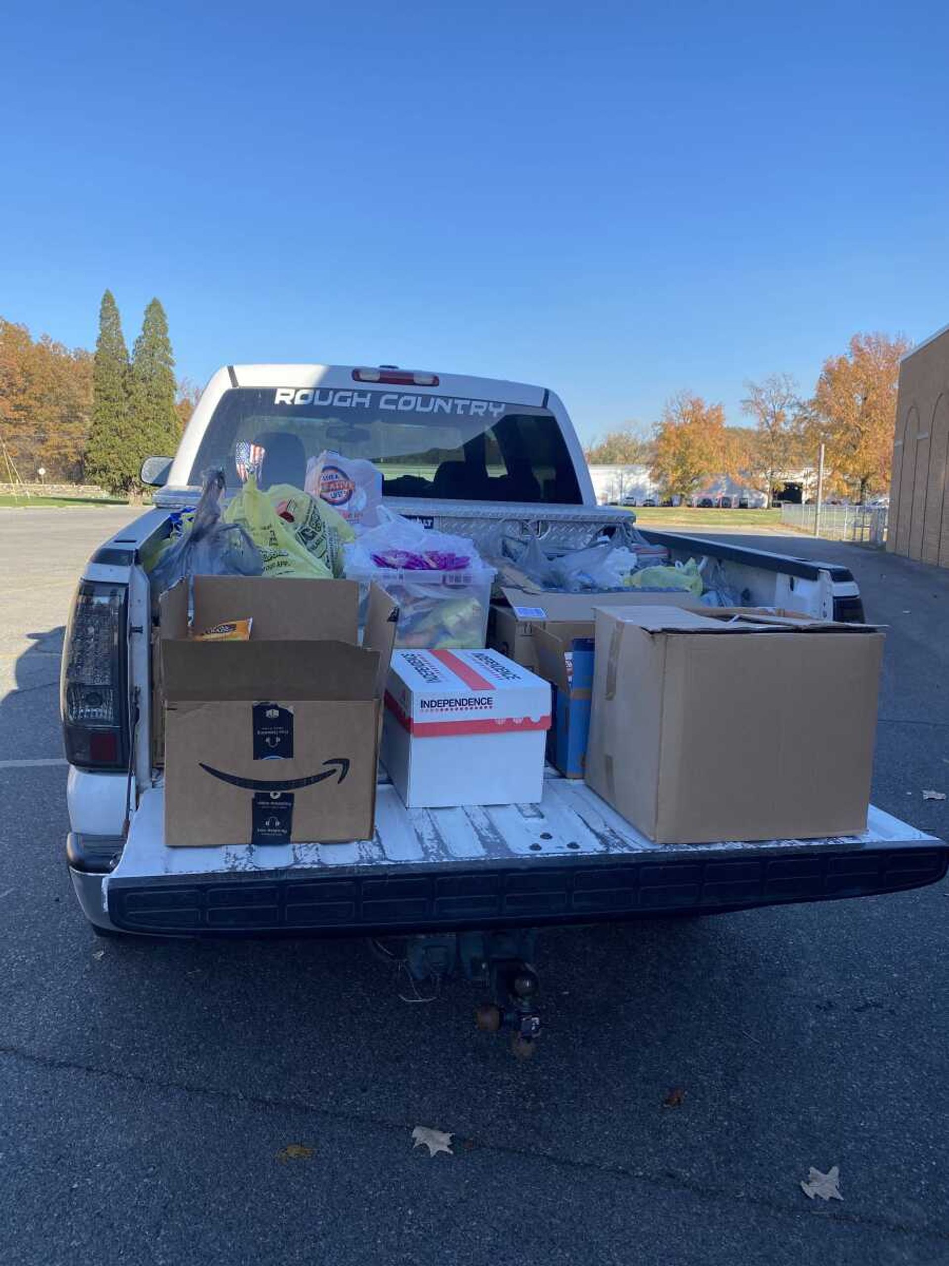 The Oran Public students stacked food compactly to get it all to fit in the bed of the truck.  From Guardian Angel School, they drove the food to the Jaycee Hall to be sorted and baskets filled.