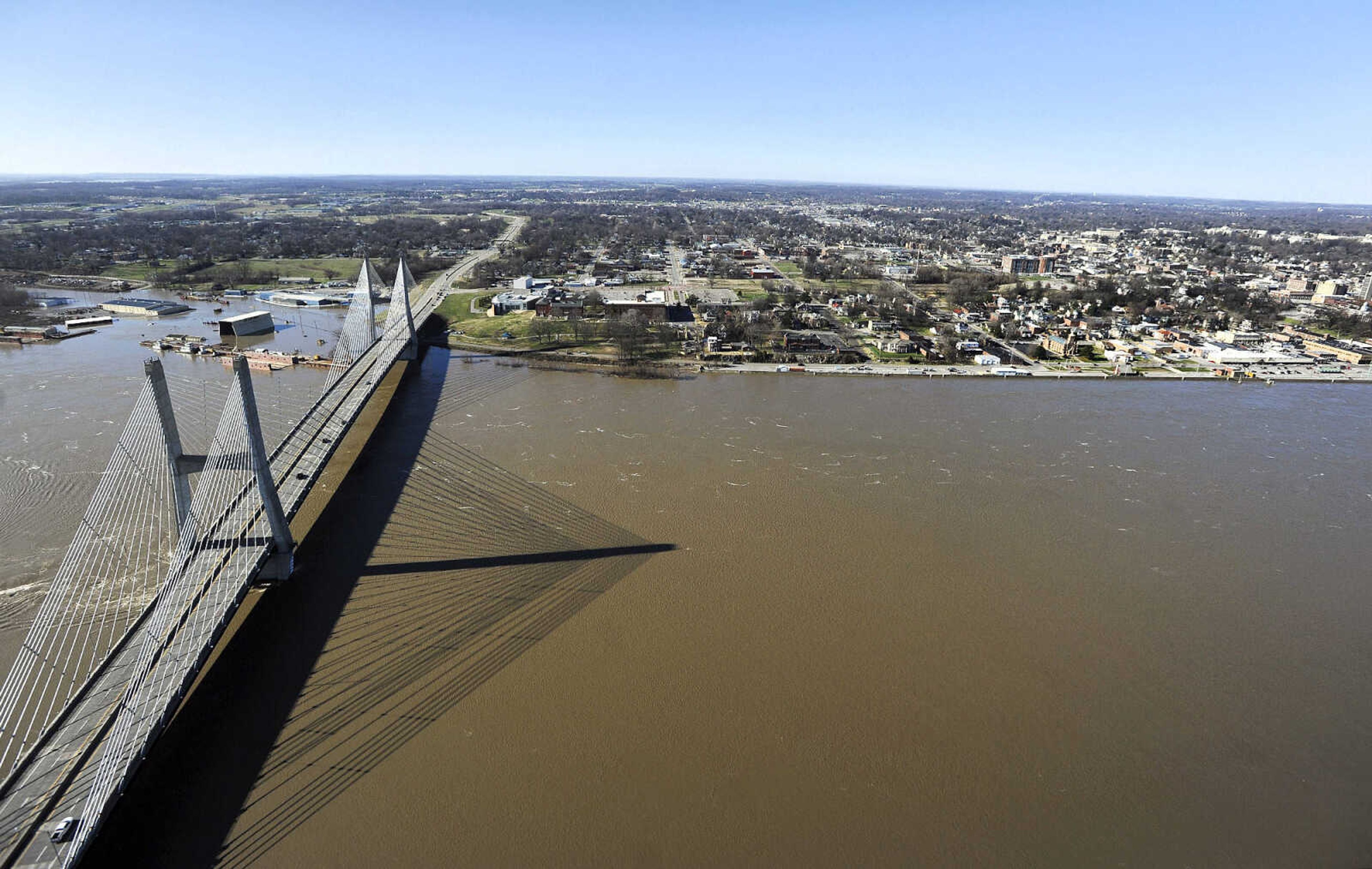 LAURA SIMON ~ lsimon@semissourian.com

The swollen Mississippi River is seen flowing under the Bill Emerson Memorial Bridge in Cape Girardeau, Saturday, Jan. 2, 2016.