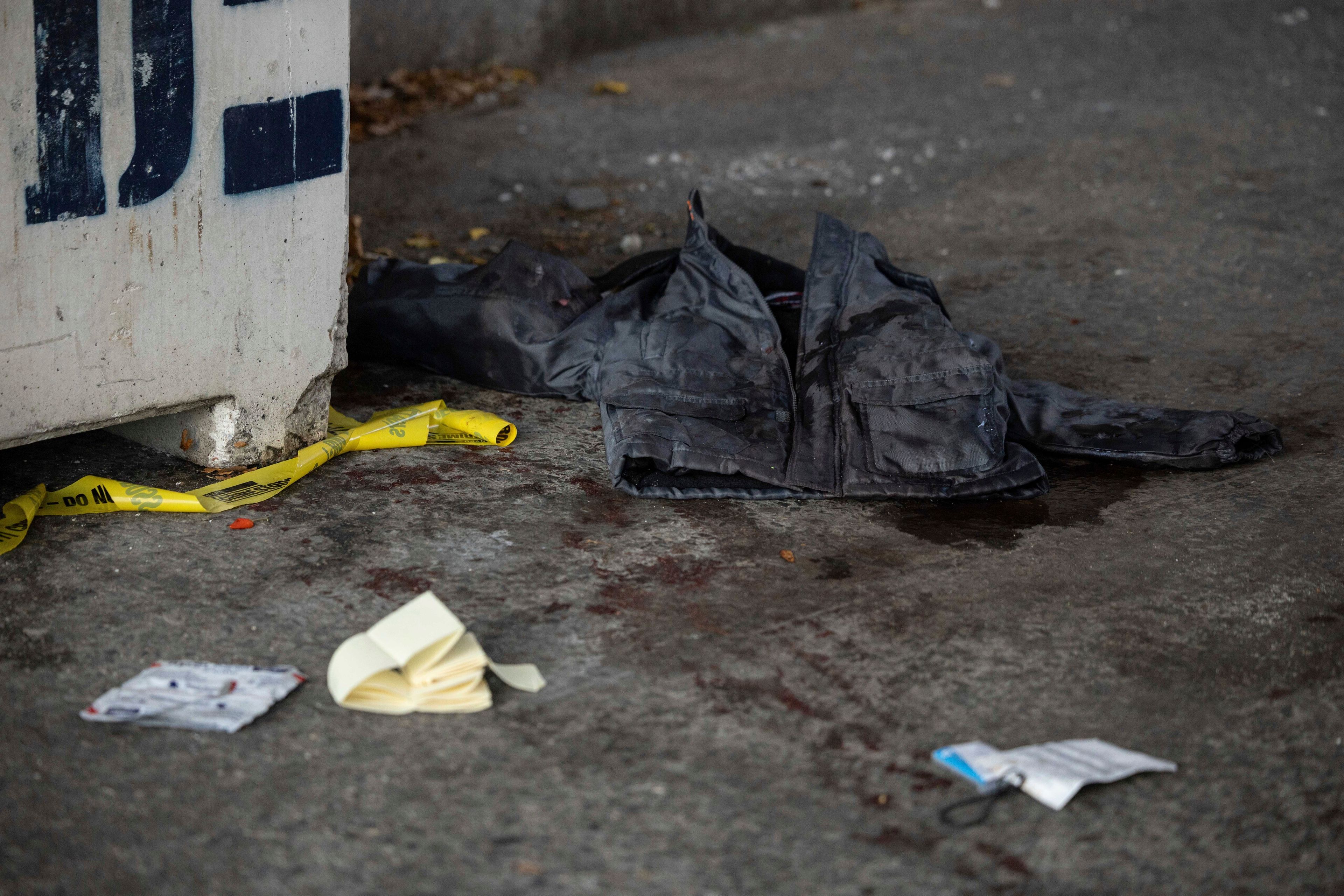 A jacket covered in blood lays on the ground at the site of a stabbing spree near the United Nations Headquarters in New York, Monday, Nov. 18, 2024. (AP Photo/Yuki Iwamura)