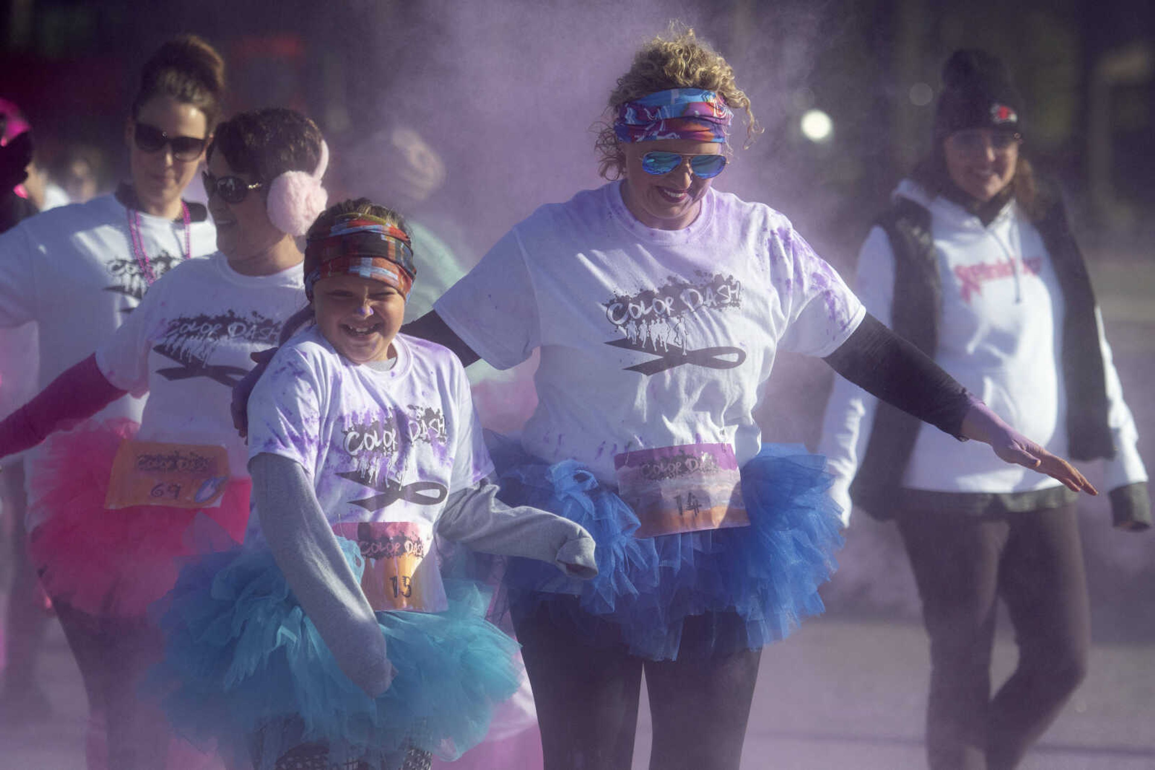 Jessica Boyd of Marble Hill, Missouri, and her daughter Brissa Boyd, 7, take part in the Saint Francis Foundation's first Color Dash on Saturday, Oct. 12, 2019, at Arena Park in Cape Girardeau.