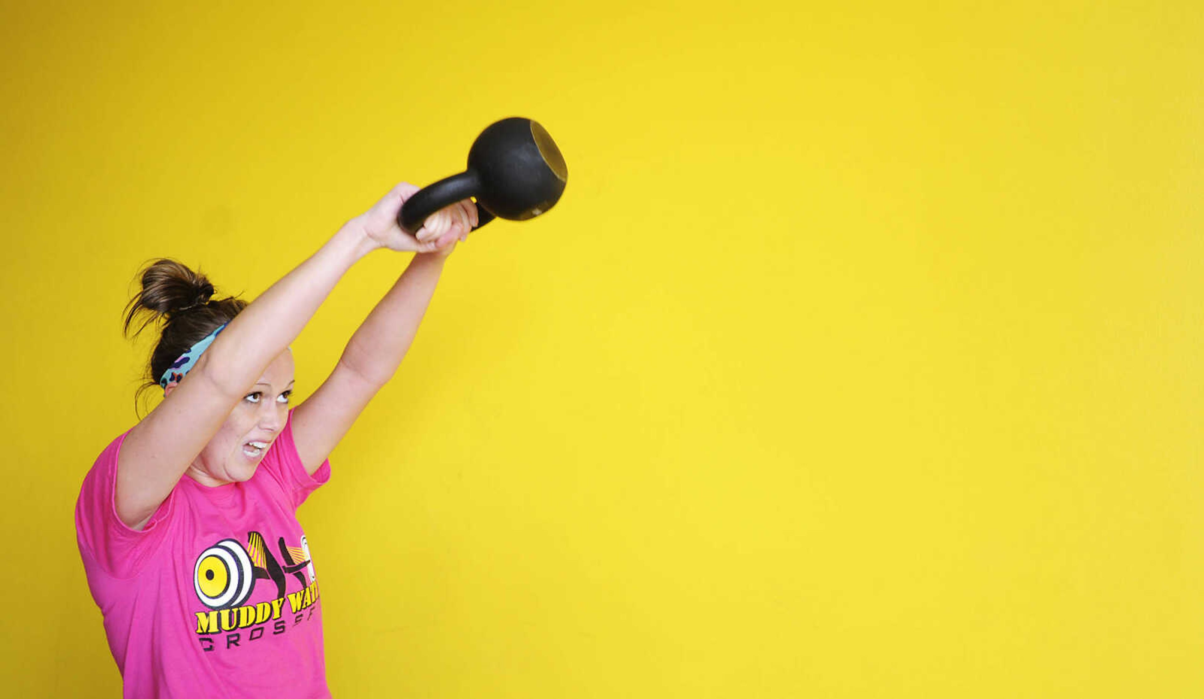 ADAM VOGLER ~ avogler@semissourian.com
Kandra Baker during a Crossfit class Friday, Jan. 11, at Muddy Water Crossfit, 749 Enterprise Drive, Cape Girardeau. The class is described as a â€śconstantly varied, high intensity, functional movement," strength and conditioning program.