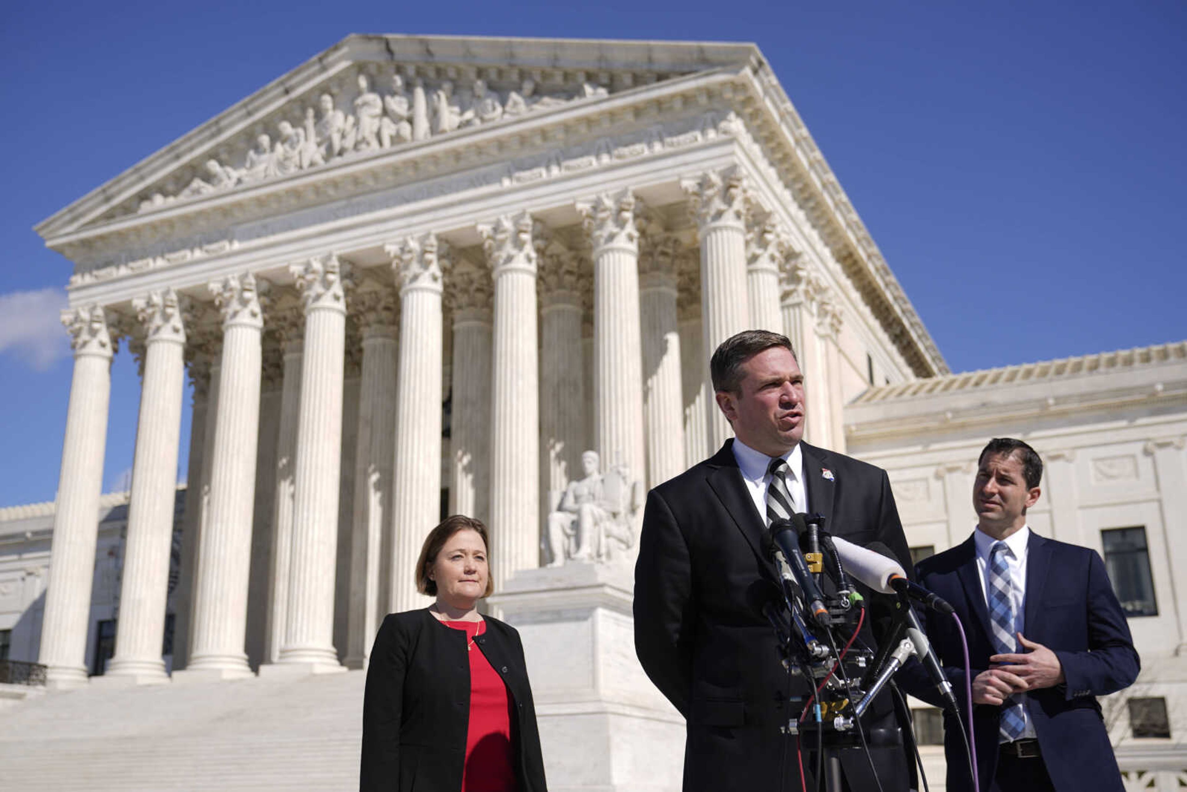 Missouri Attorney General Andrew Bailey speaks with reporters outside the Supreme Court on Capitol Hill in Washington, Tuesday, Feb. 28, 2023, after the court heard arguments over President Joe Biden's student debt relief plan. Standing behind Bailey are Iowa Attorney General Brenna Bird, back left, and Nebraska Solicitor General Jim Campbell. (AP Photo/Patrick Semansky)