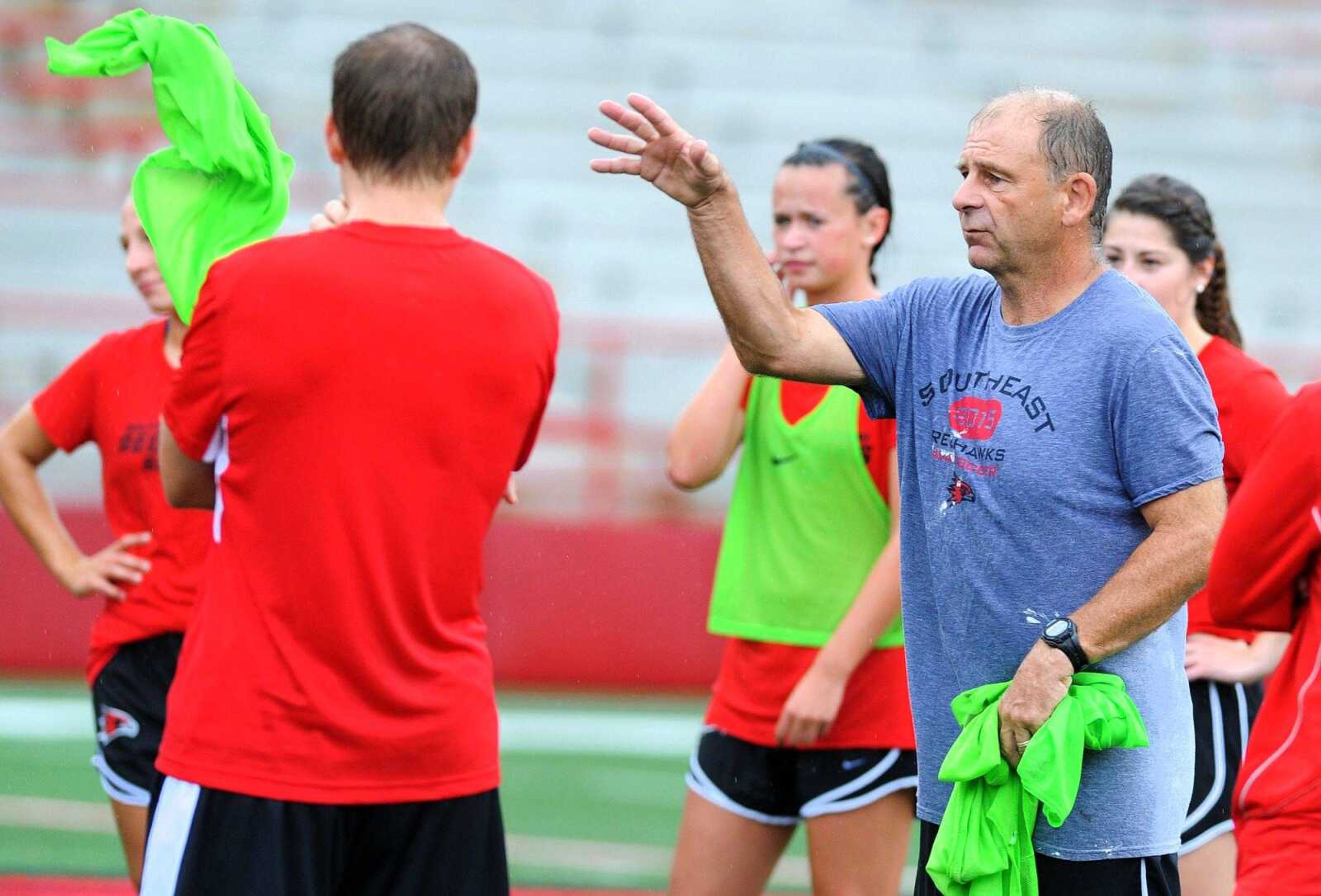 Assistant head coach Paul Nelson leads players as the Southeast Missouri State soccer team practices, Wednesday, Aug. 5, 2015, at Houck Stadium in Cape Girardeau. (Laura Simon)