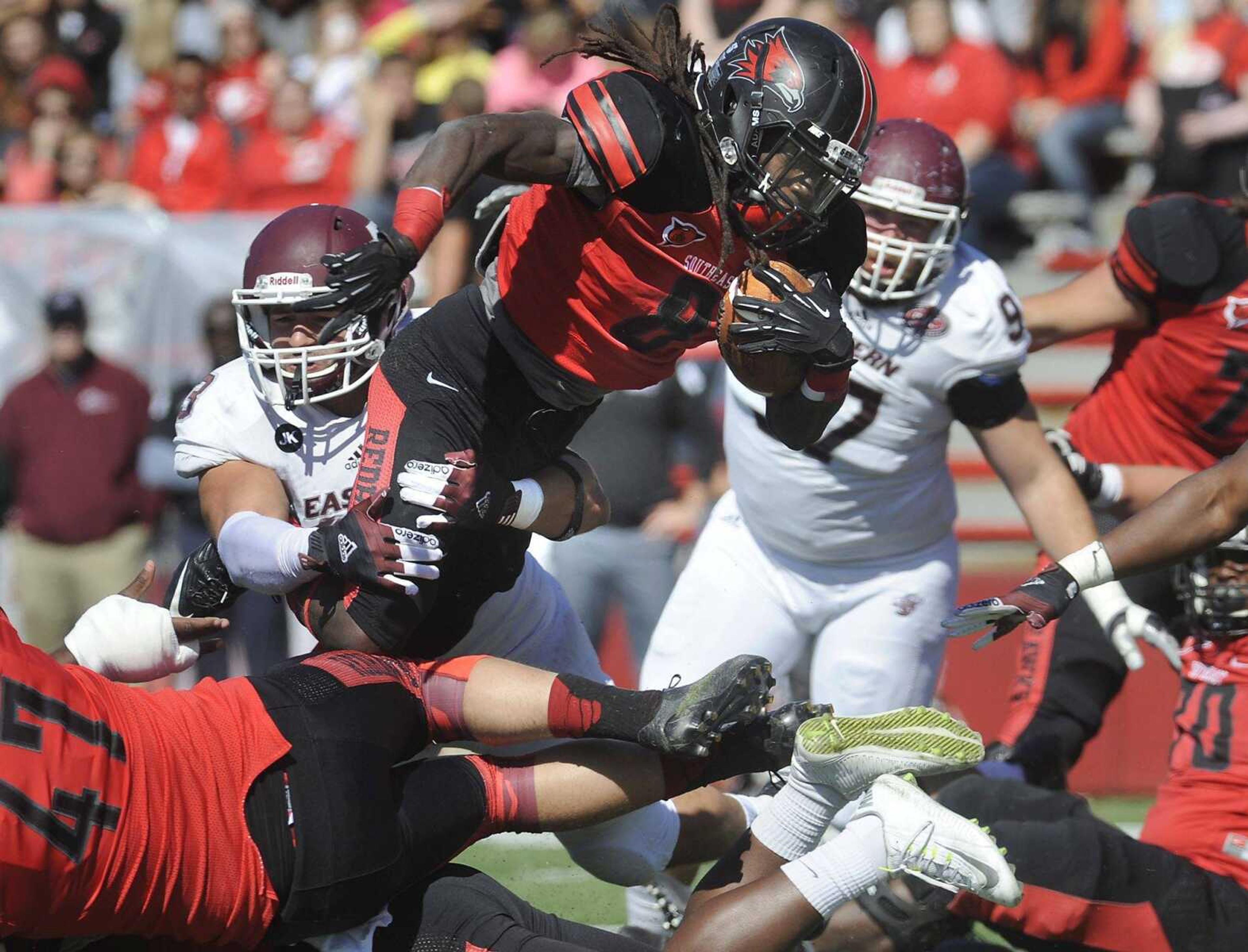 Southeast Missouri State's Tremane McCullough rushes for a yard against Eastern Kentucky's Jeffrey Canady during the first quarter Saturday at Houck Stadium. (Fred Lynch)