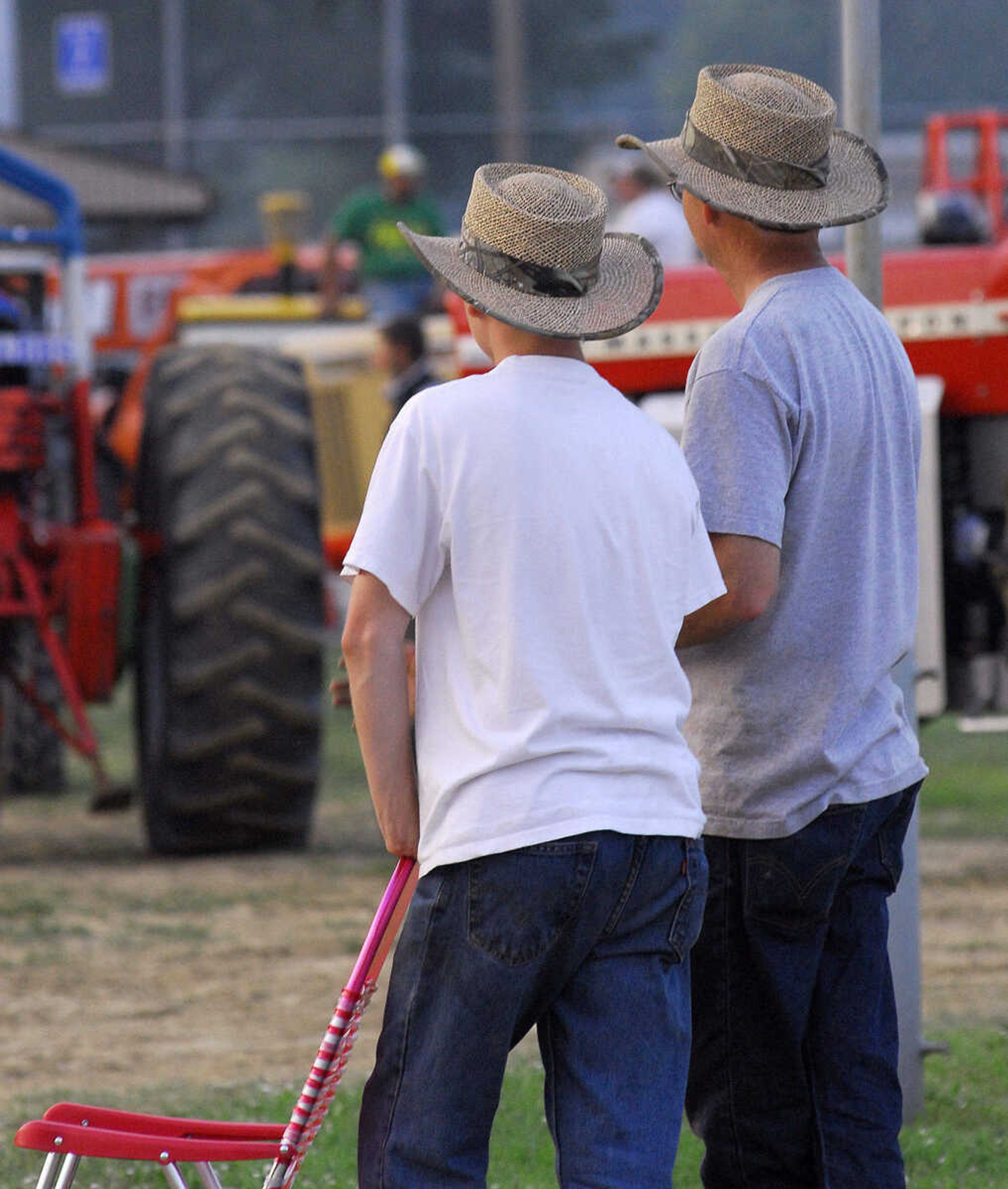 LAURA SIMON~lsimon@semissourian.com
Spectators watch from the sidelines Saturday, May 29, 2010 during the "Pullin' for St. Jude" tractor and truck pull at Arena Park.