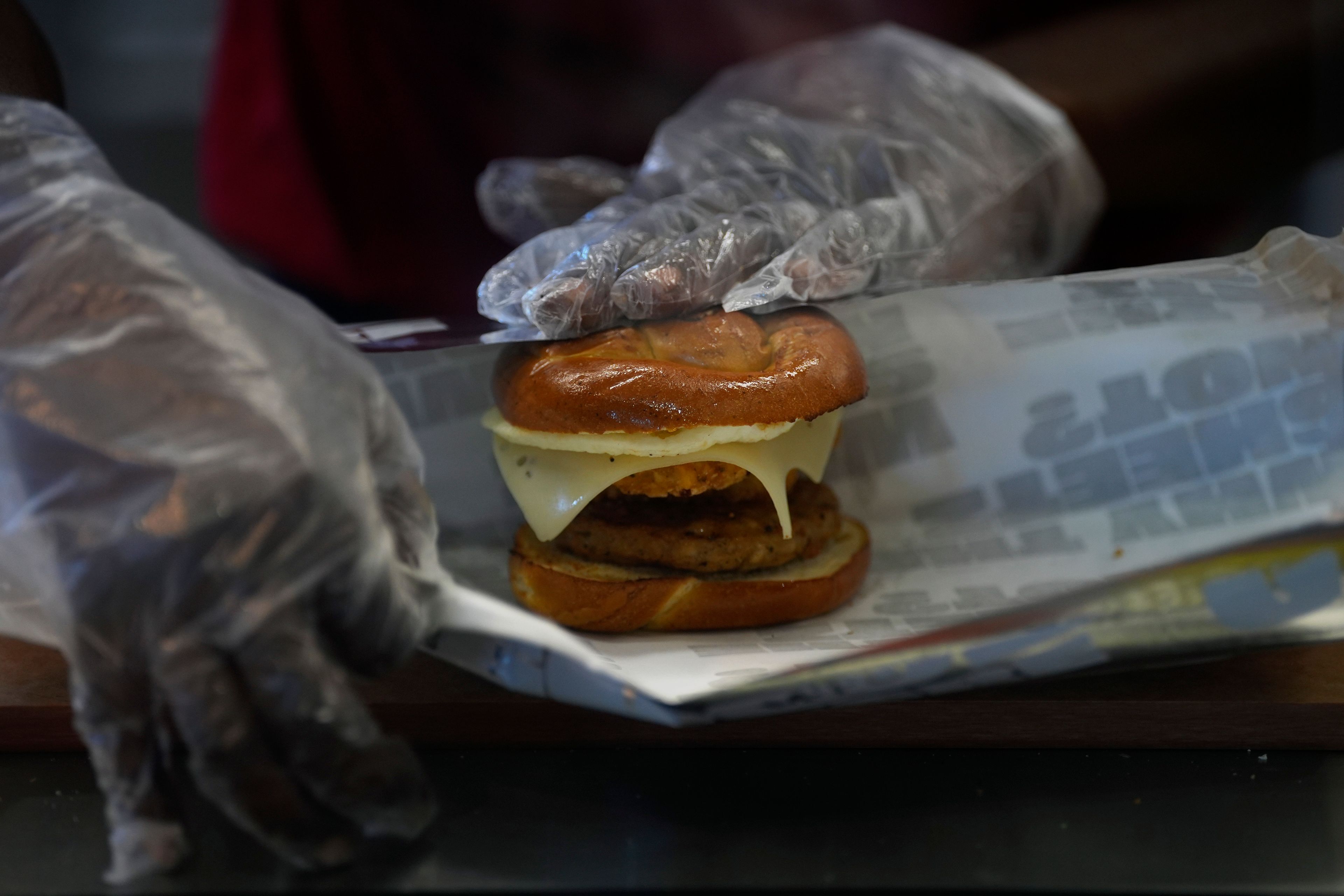 A Sheetz employee prepares a breakfast sandwich at the convenience store, Thursday, Oct. 17, 2024, in Bethlehem, Pa. (AP Photo/Matt Slocum)