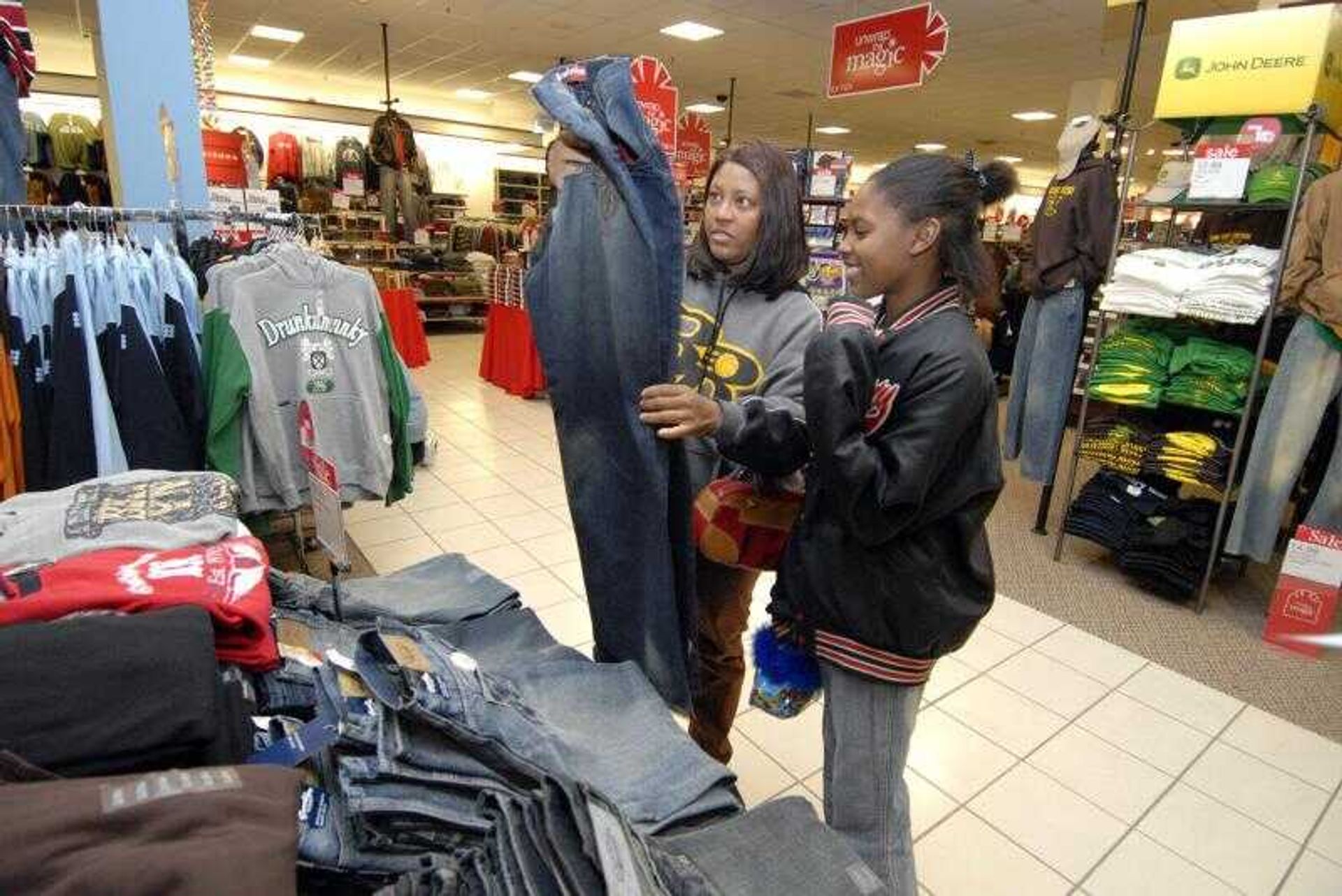 Bridgett Johnson, left, and her daughter Jasmine Johnson, 12, shopped for bargains at the Penney's store located in West Park Mall recently. (Don Frazier)