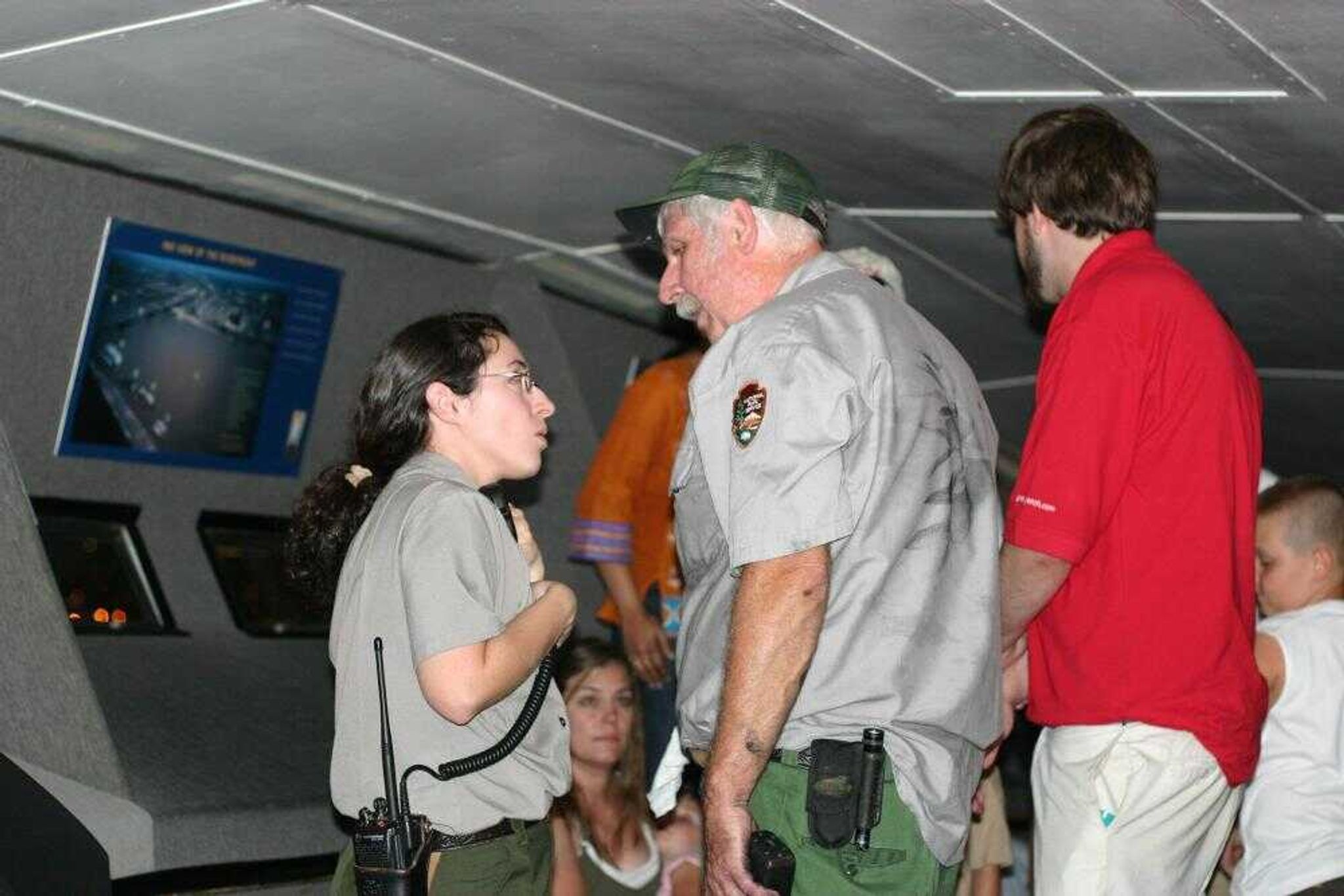 In this photo provided by Eli Lawson, Amy Skrabacz, left, talks to an unidentified National Park Service member Saturday, July 21, 2007, at the top of the Gateway Arch in St. Louis. Arch's deputy superintendent, Frank Mares said visitors at the top of the Arch had to wait about three hours to get down Saturday while those inside the tram cars waited about two hours after a power failure stalled the two trams filled with about 40 people each. (AP Photo/Eli Lawson)