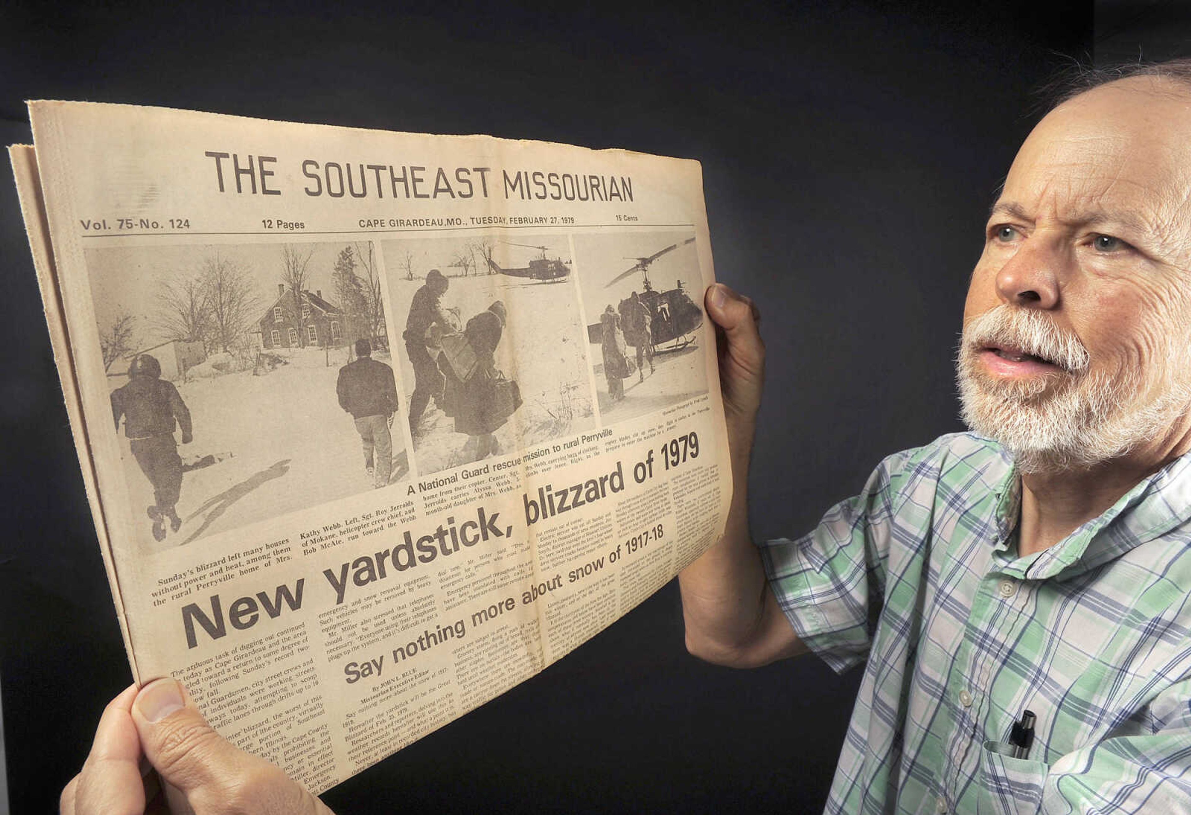 Fred Lynch shows the Feb. 27, 1979 edition of the Southeast Missourian with its coverage of the Blizzard of 1979. His photographs show a National Guard helicopter crew rescuing Kathy Webb and her 3-month-old daughter, Alyssa, from their rural Perryville, Missouri home that had no power or heat.