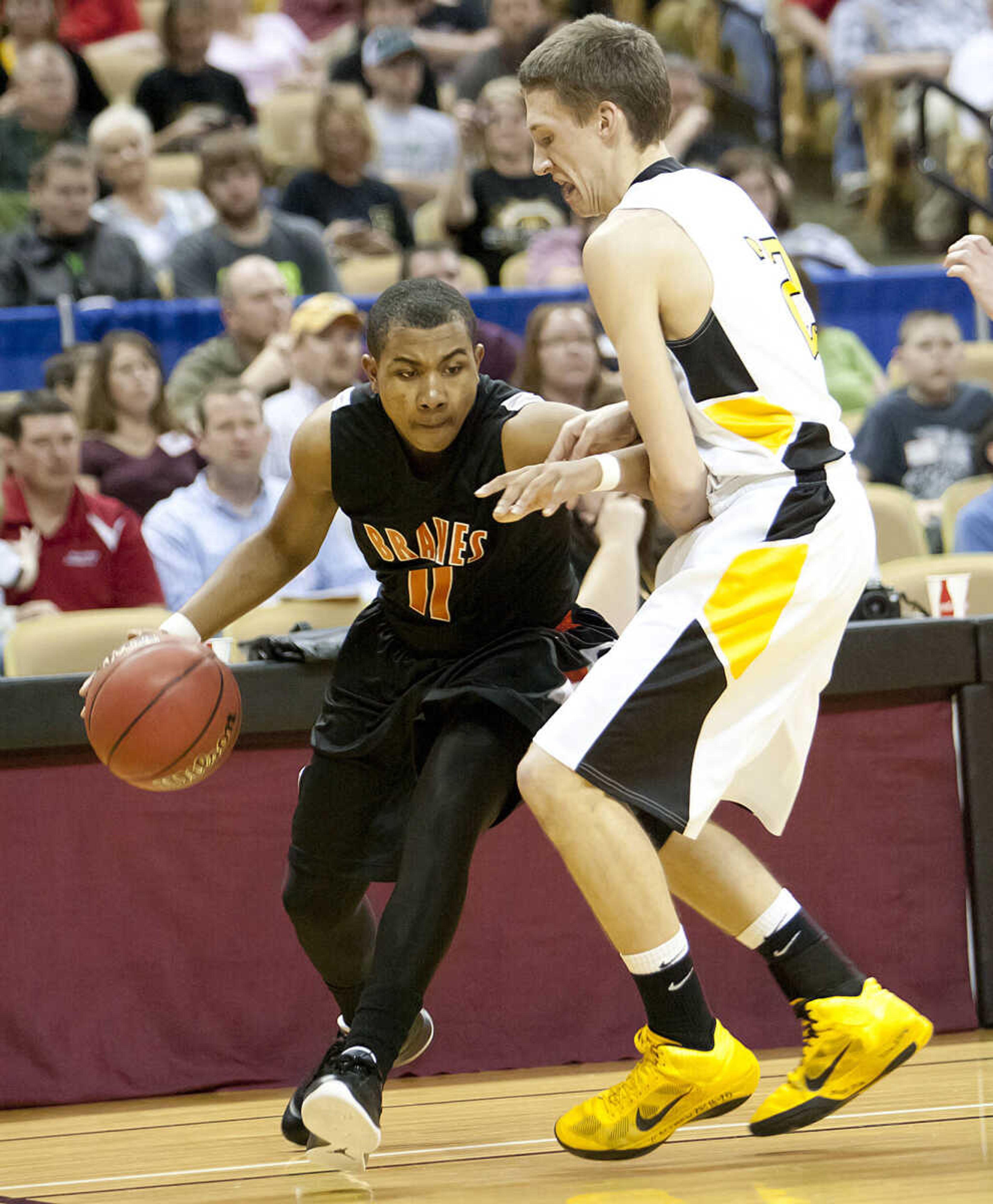 Scott County Central forward Jaylen Porter drives inside of Drexel forward Craig Bolton during the Braves' 79-72 win over the Bobcats in the Class 1 championship game in Columbia, Mo. Porter had 10 rebounds in Scott County Central's fourth consecutive state championship win. (Adam Vogler)