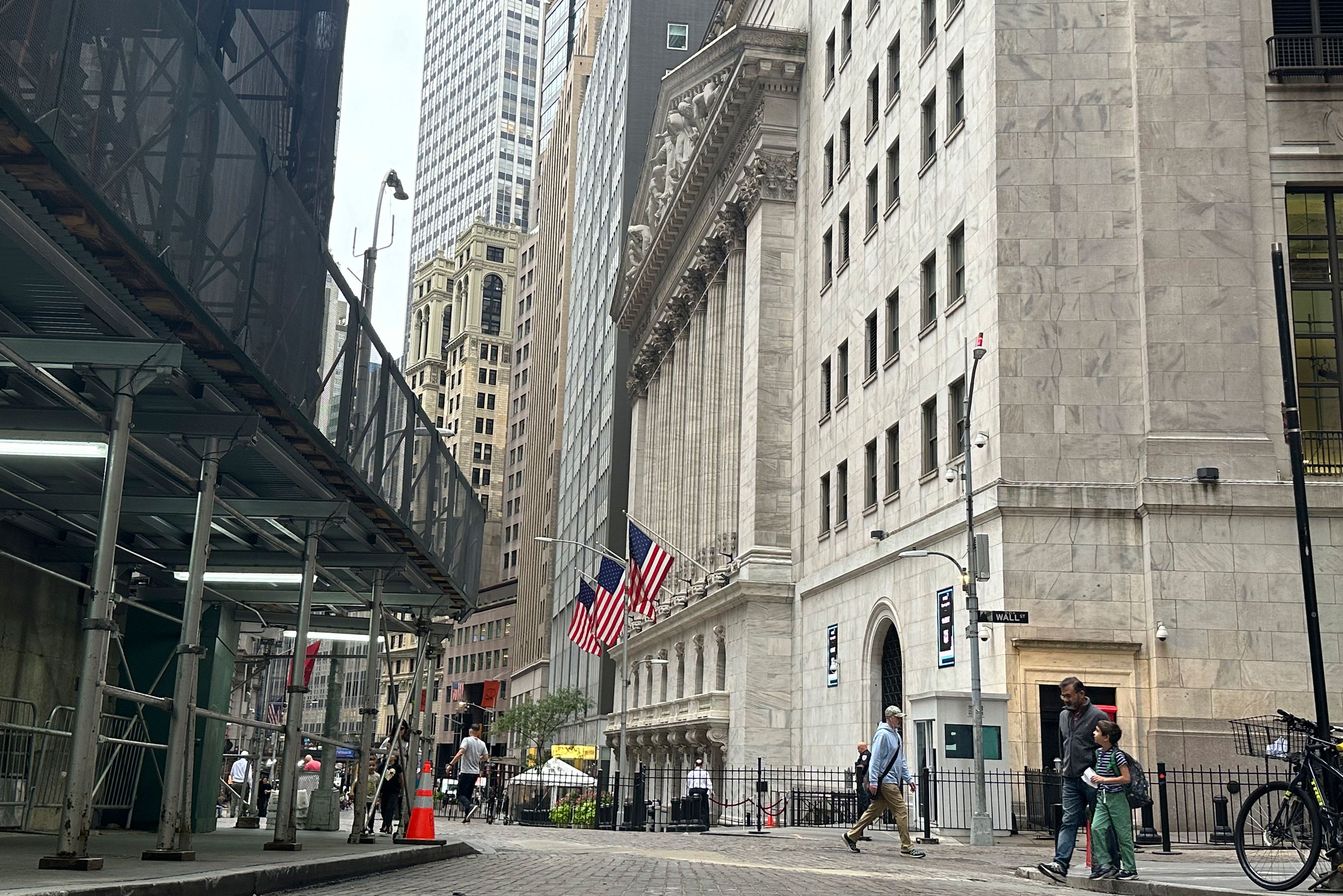 The New York Stock Exchange, center, is shown on Friday, Sept. 27, 2024, in New York. (AP Photo/Peter Morgan)