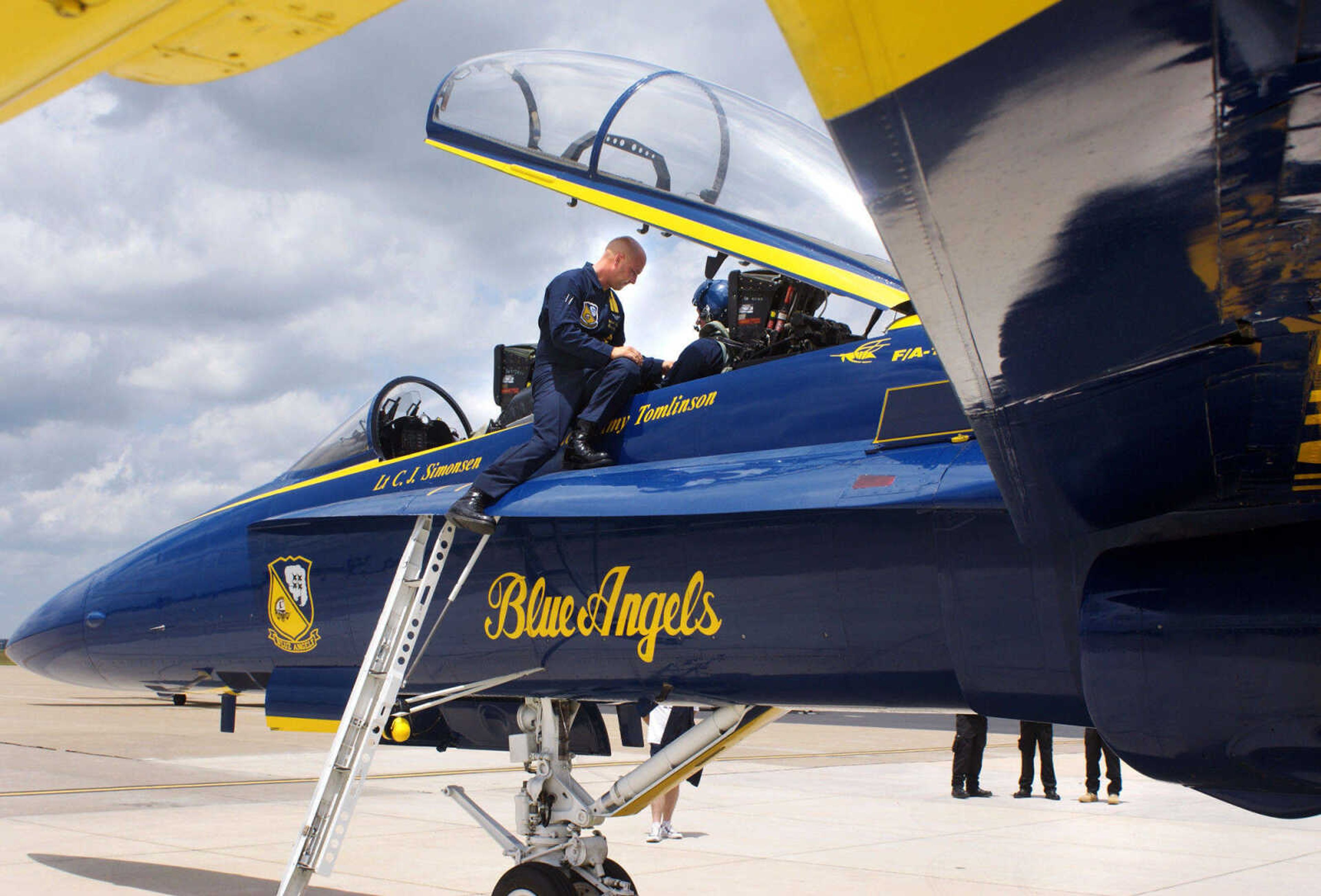 BAILEY REUTZEL ~ breutzel@semissourian.com

Rob Bunger gets strapped into the Blue Angels' F/A-18 plane by #7 Crew Chief Chad Swanson, left, at the Cape Girardeau Airport on Wednesday, June 16, 2010. Bunger was one of three area people who got the chance to fly with the Blue Angels on Wednesday.