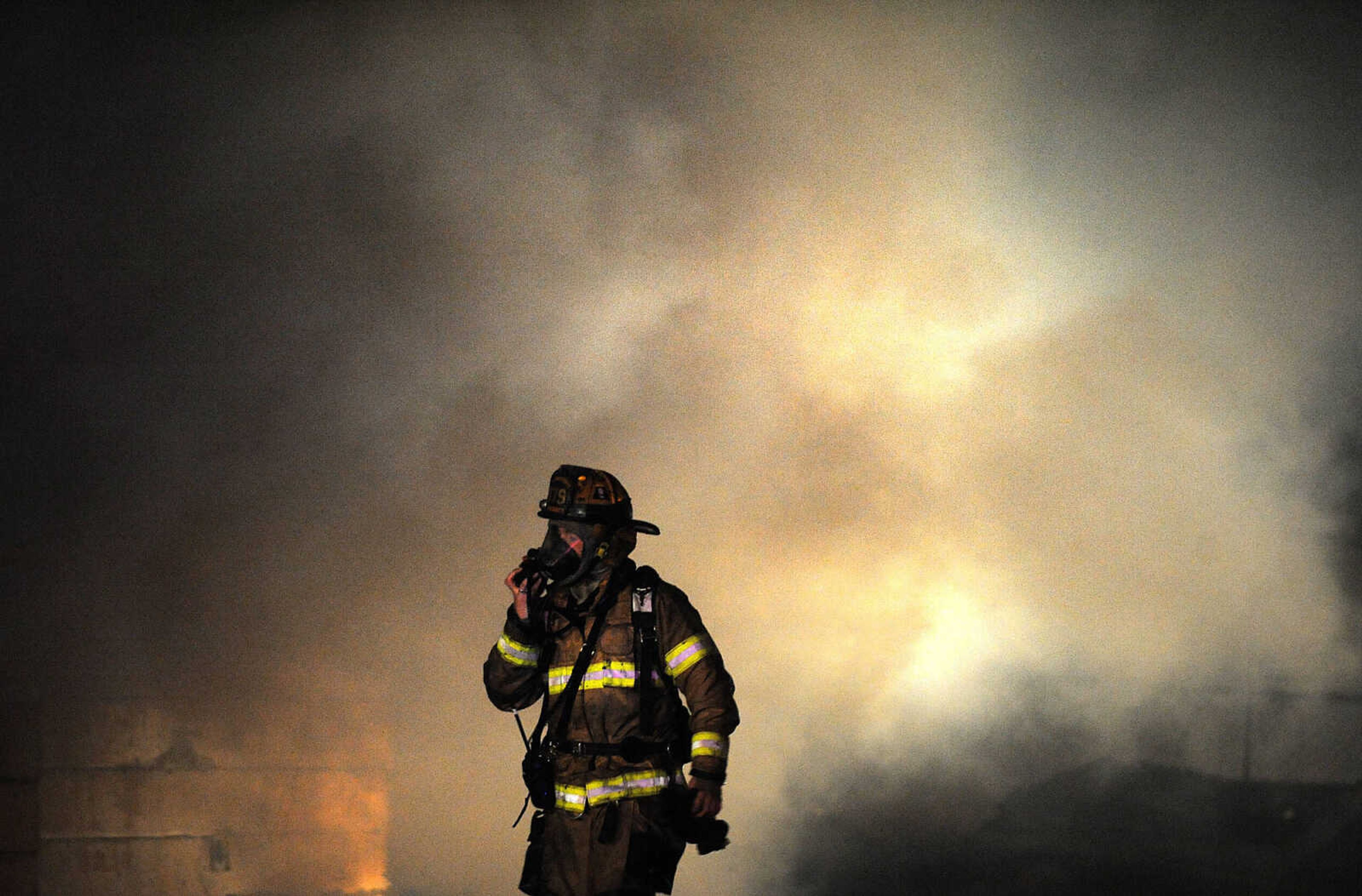 LAURA SIMON ~ lsimon@semissourian.com

Members of the Scott City and Cape Girardeau fire departments battle a blaze at 308 W. Missouri Blvd. in Scott City, Wednesday, Dec. 18, 2013. Nobody was injured in the fire.