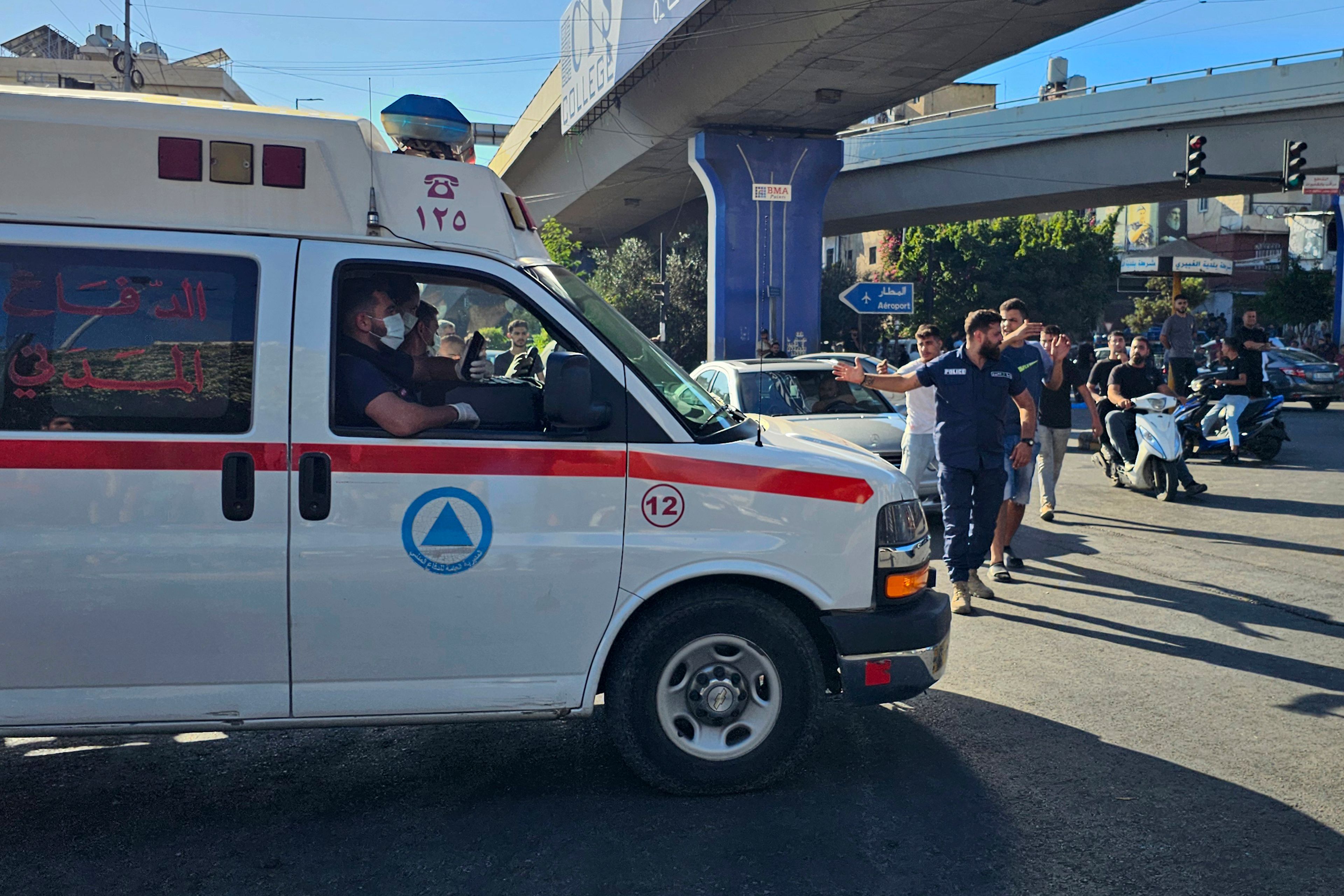 An ambulance carries wounded people whose handheld pager exploded, in Beirut, Lebanon, Tuesday, Sept. 17, 2024. (AP Photo/Hassan Ammar)