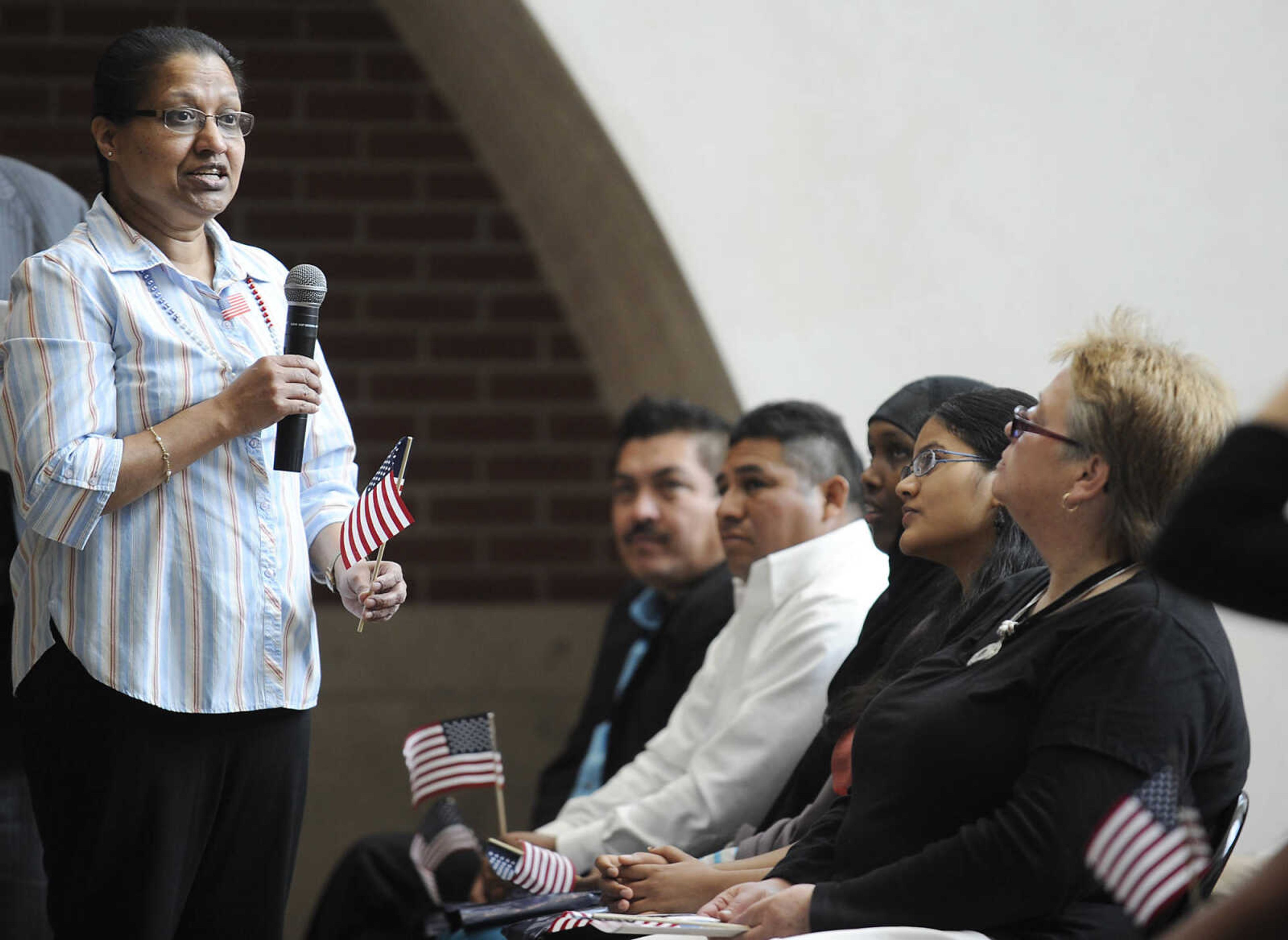 Emilda Lily Pinto, who immigrated to the U.S. from India, speaks about becoming a U.S. citizen during a naturalization ceremony Wednesday, May 1, at the Rush H. Limbaugh Sr. U.S. Courthouse in Cape Girardeau. Pinto was one of 29 people from 11 countries who were administered the Oath of Allegiance, making them U.S. citizens, by U.S. District Court Judge Stephen N. Limbaugh Jr. during the ceremony.