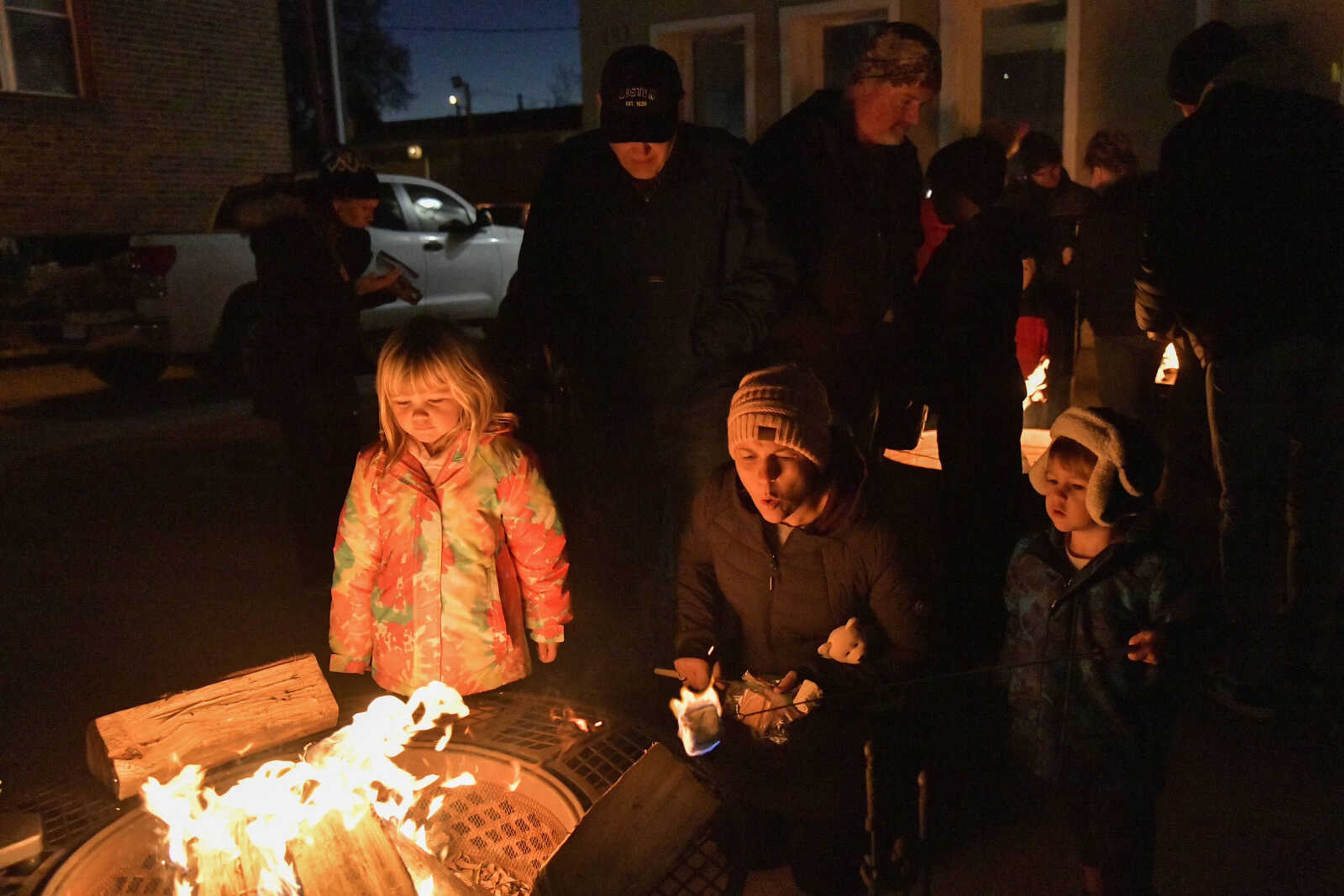 Attendees makes s'mores with supplies provided by Banterra Bank during the 3rd Annual Old Town Cape Christmas Tree Lighting on Friday in Cape Girardeau.