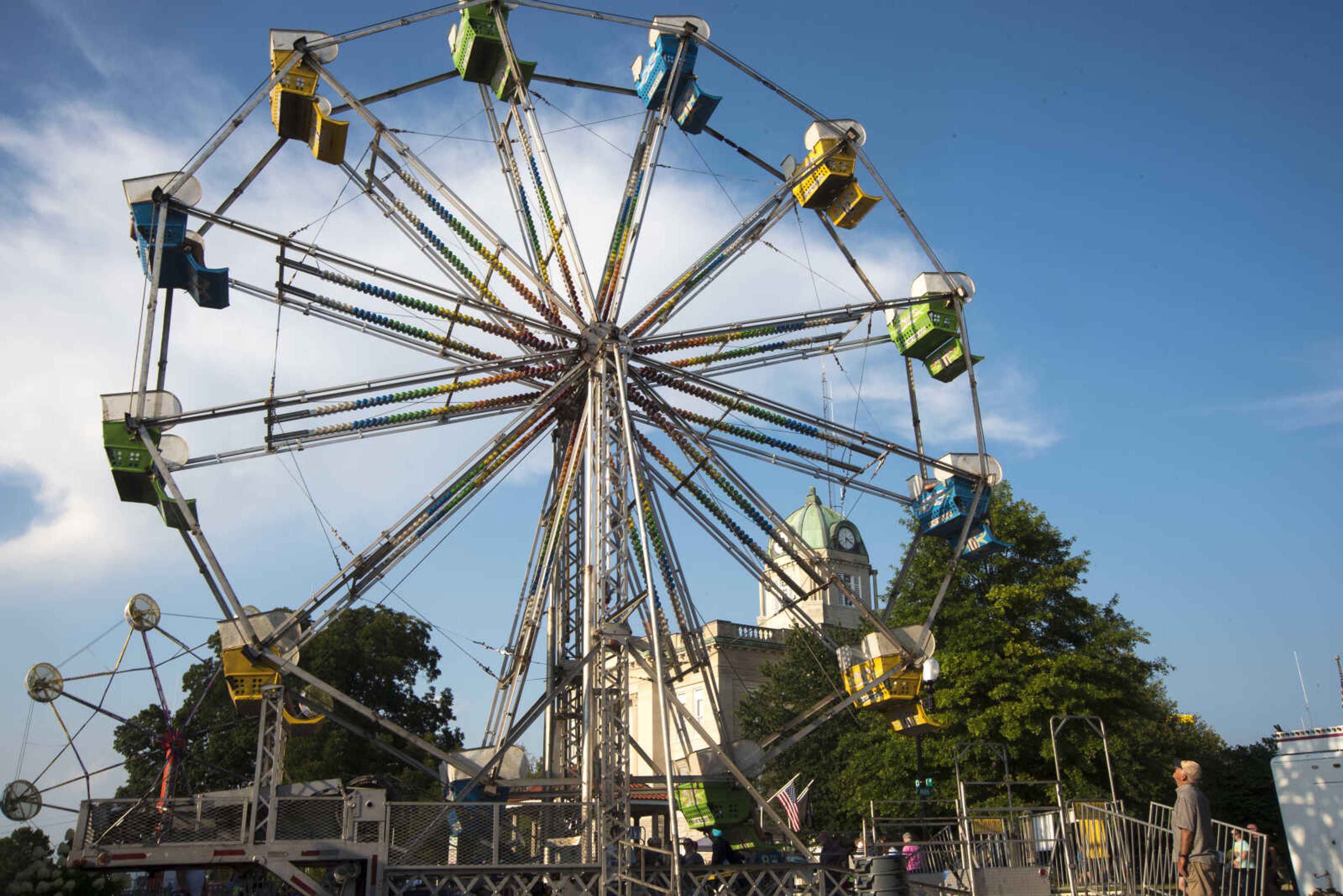 People ride the ferris wheel at the Jackson Homecomers Tuesday, July 25, 2017 in Uptown Jackson.