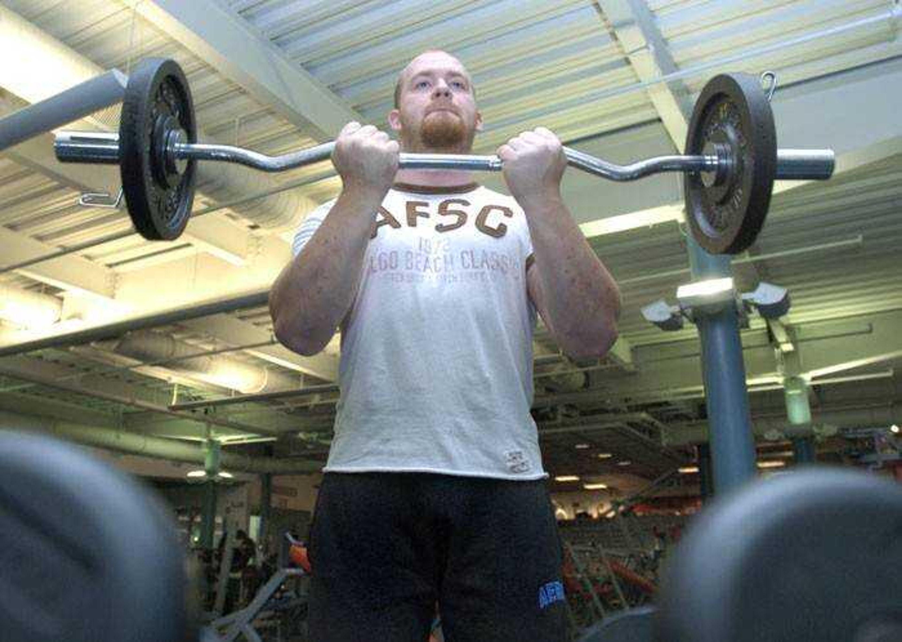 Josh Waszkurak exercised with bicep curls during a workout he usually does five days a week. (Fred Lynch)