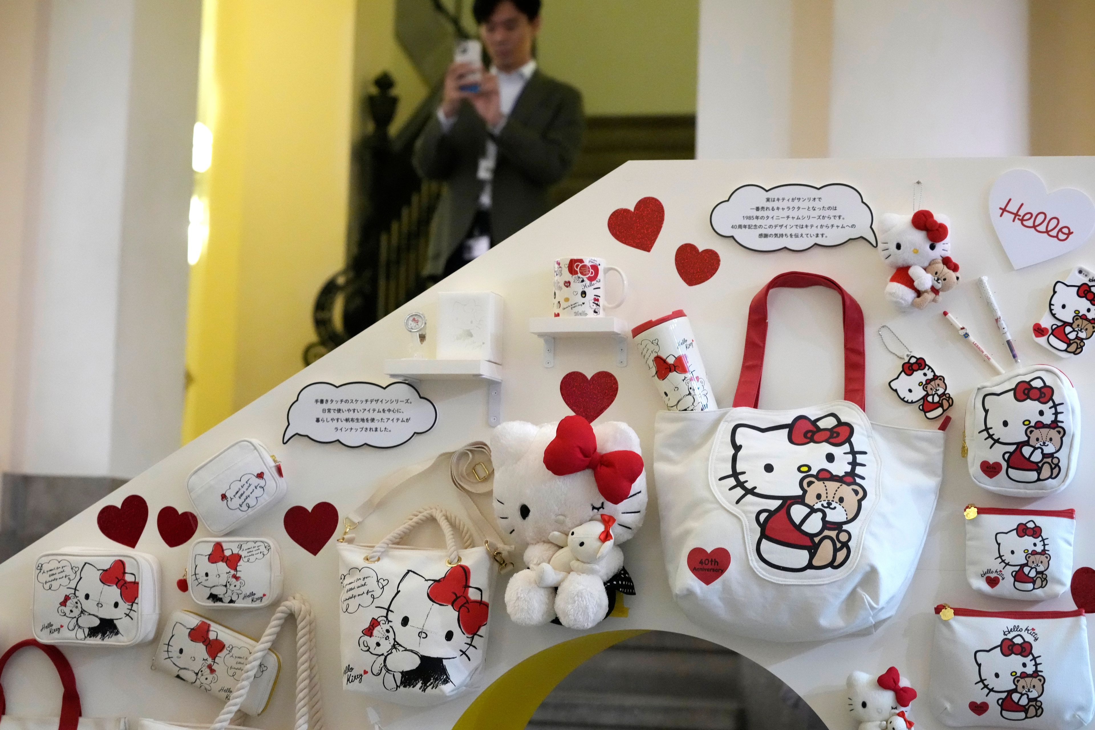 A visitor looks at Hello Kitty display at the exhibition "As I change, so does she," marking the 50th anniversary of Hello Kitty at the Tokyo National Museum in Tokyo Wednesday, Oct. 30, 2024. (AP Photo/Shuji Kajiyama)