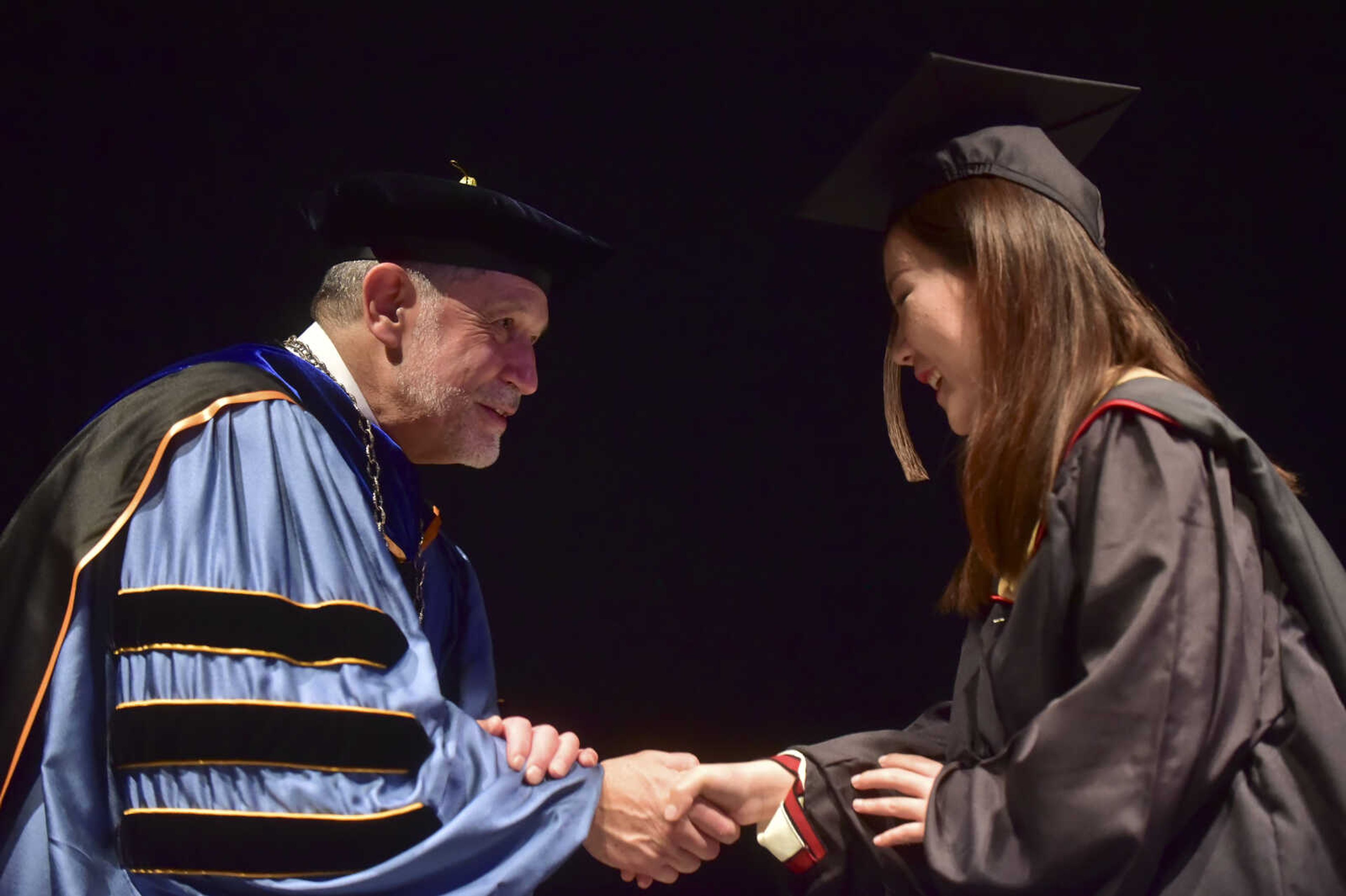 ANDREW J. WHITAKER ~ awhitaker@semissourian.com
Students walk on stage during Southeast Missouri State University graduation Saturday, Dec. 17, 2016 at the Show Me Center in Cape Girardeau.