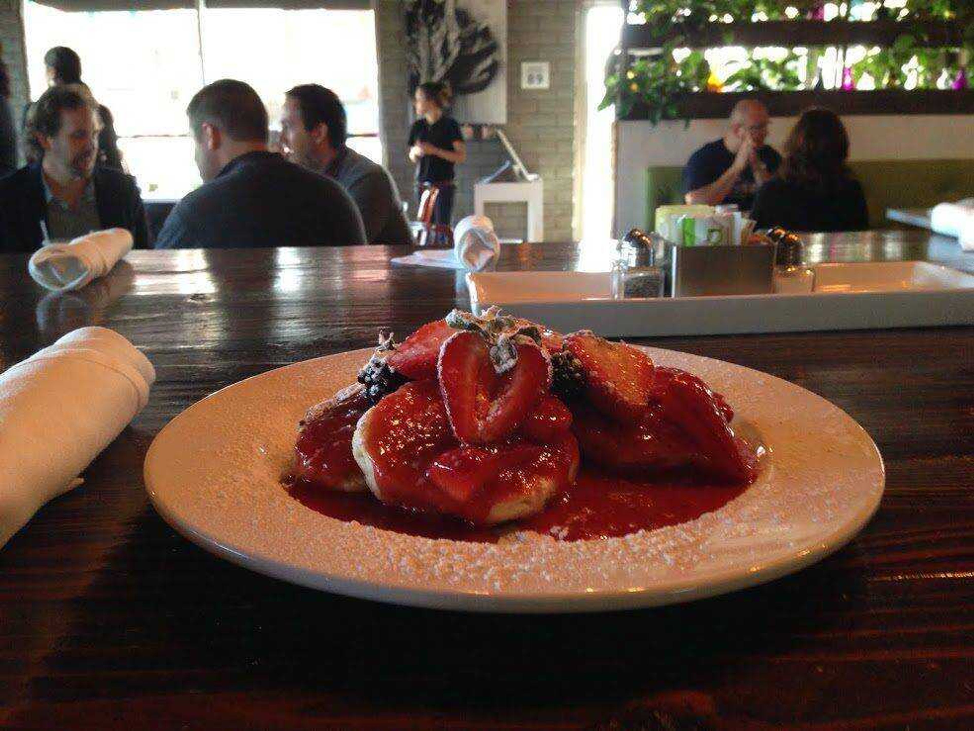 This photo shows cinnamon biscuits with warm strawberry compote at Eat in downtown Las Vegas. Eat is part of a boom in cozy neighborhood restaurants in what was once the derelict core of Las Vegas. Chef and owner Natalie Young says she designed the restaurant as an alternative to the glitzier cuisine on the Strip. (Hannah Drier ~ Associated Press)