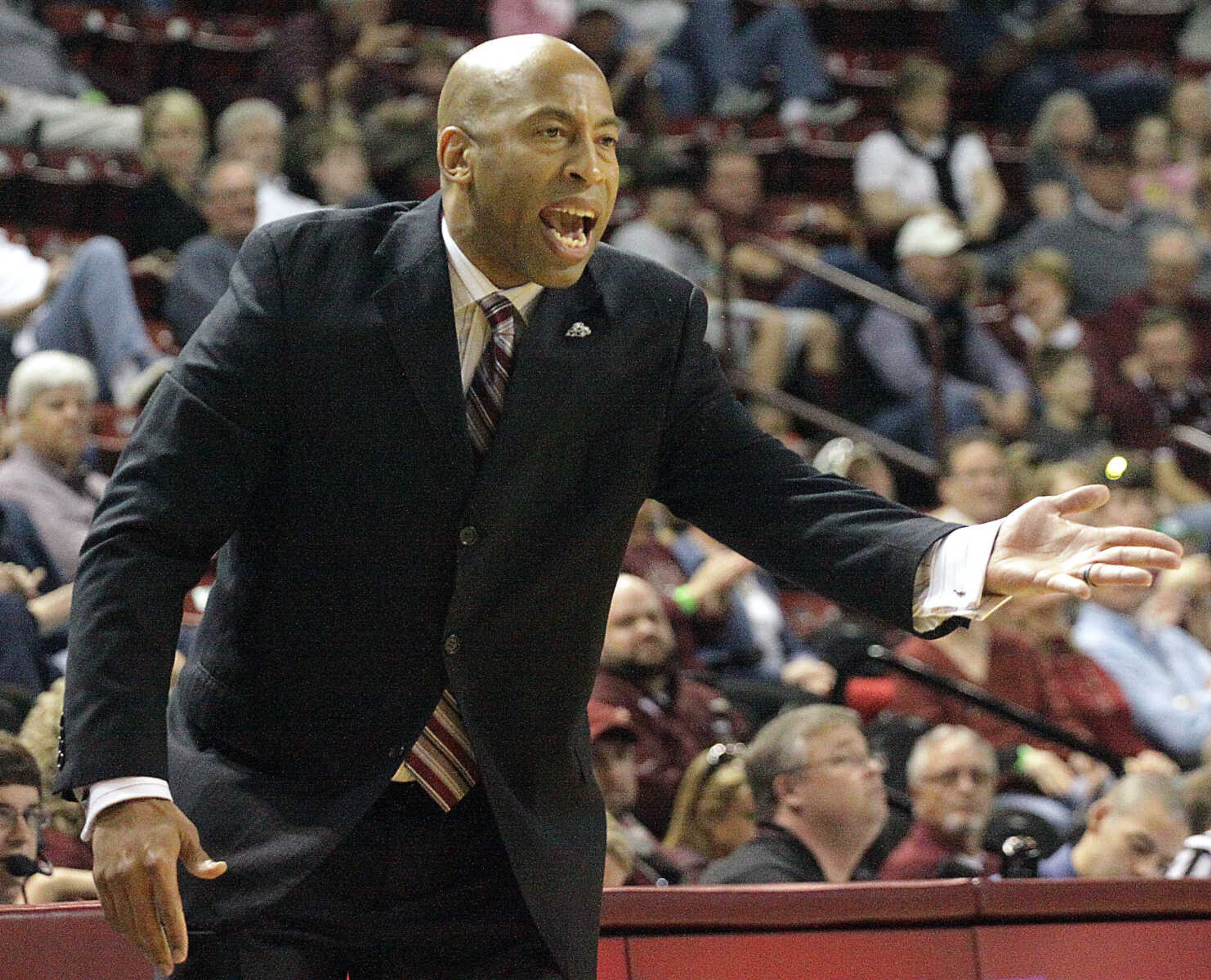 Mississippi State coach Rick Ray shouts a play during the first half of a game with South Carolina in Starkville, Miss., in 2014. (AP Photo/Jim Lytle)