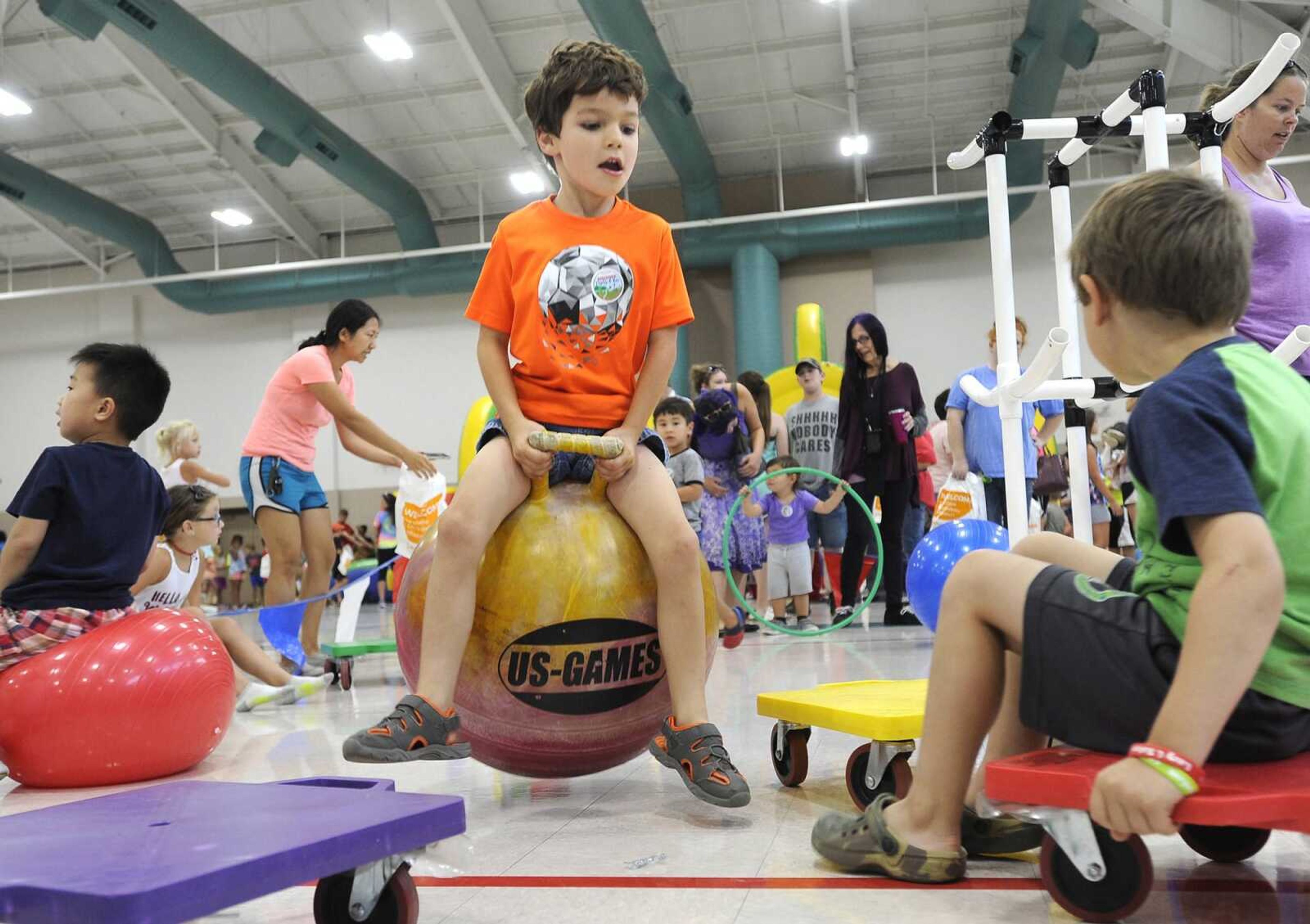 Ethan Christian bounces on a hopper ball Wednesday, July 11, 2018, during Parks and Rec Day at the Osage Centre in Cape Girardeau.